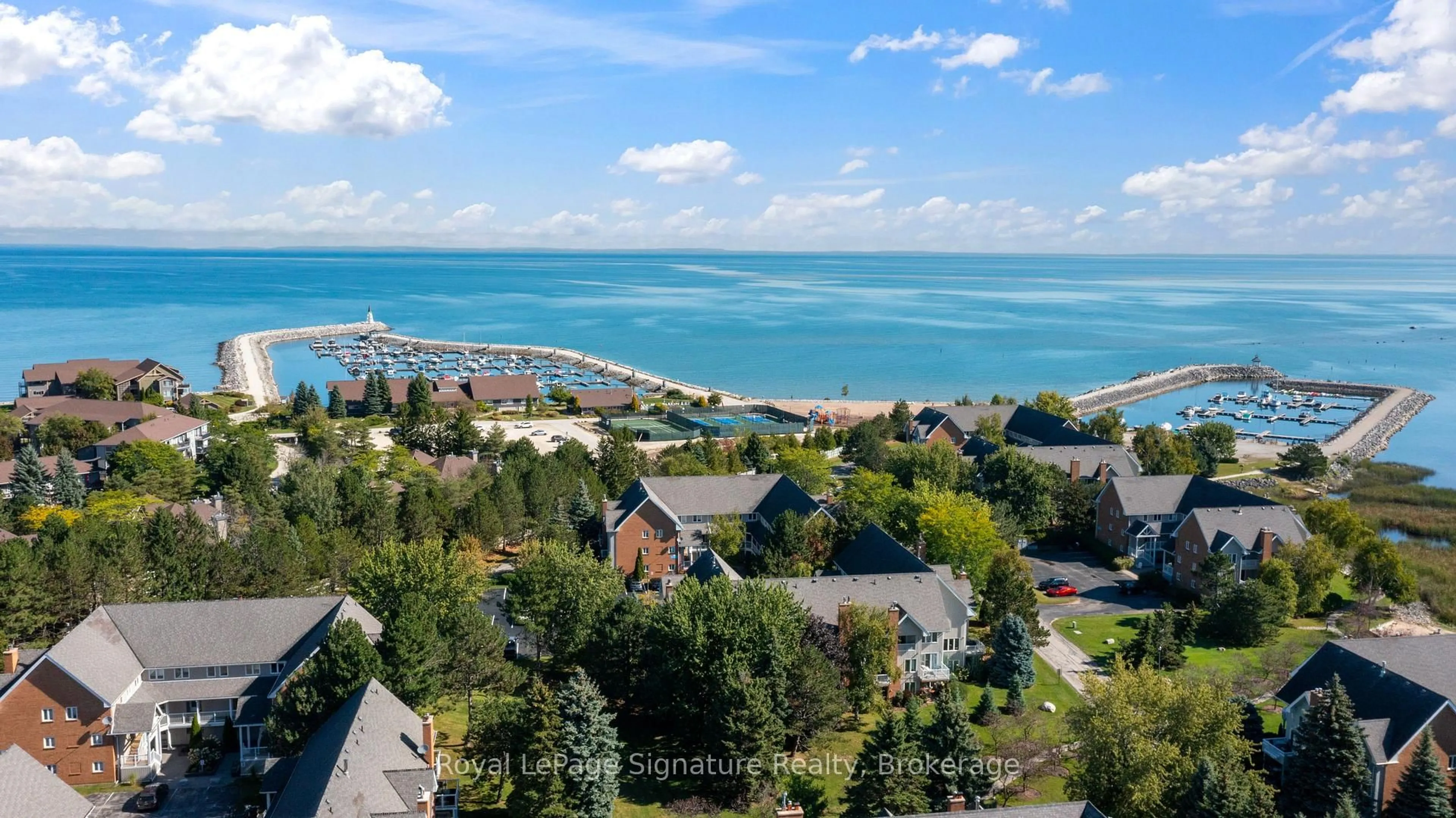 A pic from outside/outdoor area/front of a property/back of a property/a pic from drone, water/lake/river/ocean view for 18 RAMBLINGS Way #97, Collingwood Ontario L9Y 5C6