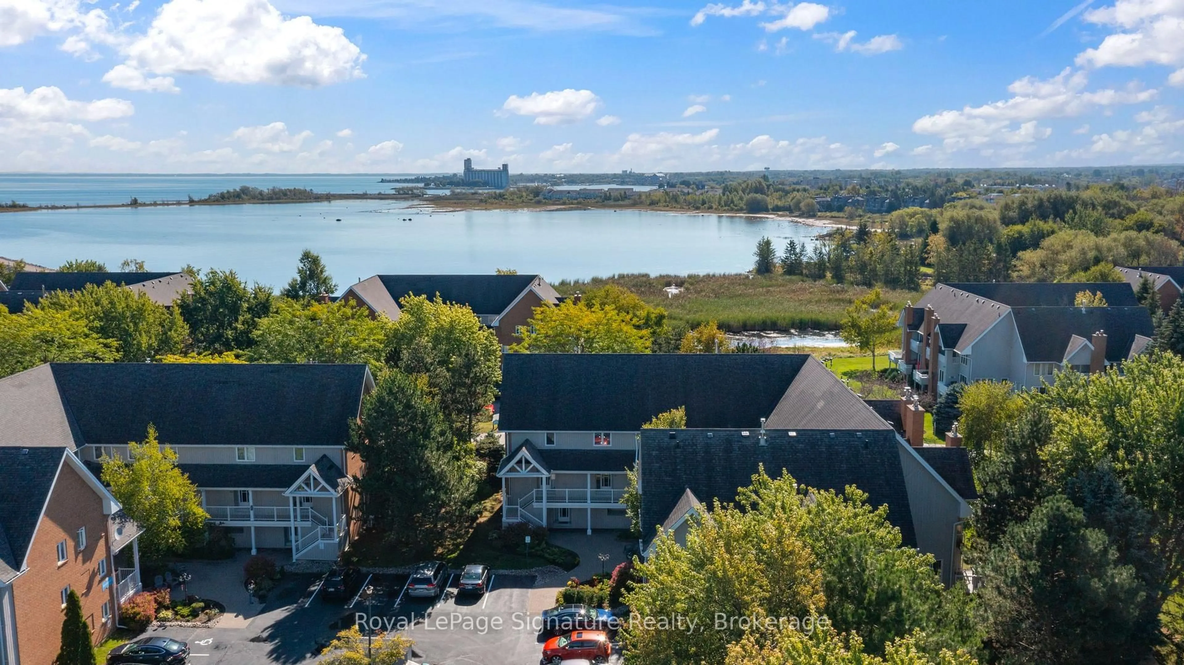 A pic from outside/outdoor area/front of a property/back of a property/a pic from drone, water/lake/river/ocean view for 18 RAMBLINGS Way #97, Collingwood Ontario L9Y 5C6