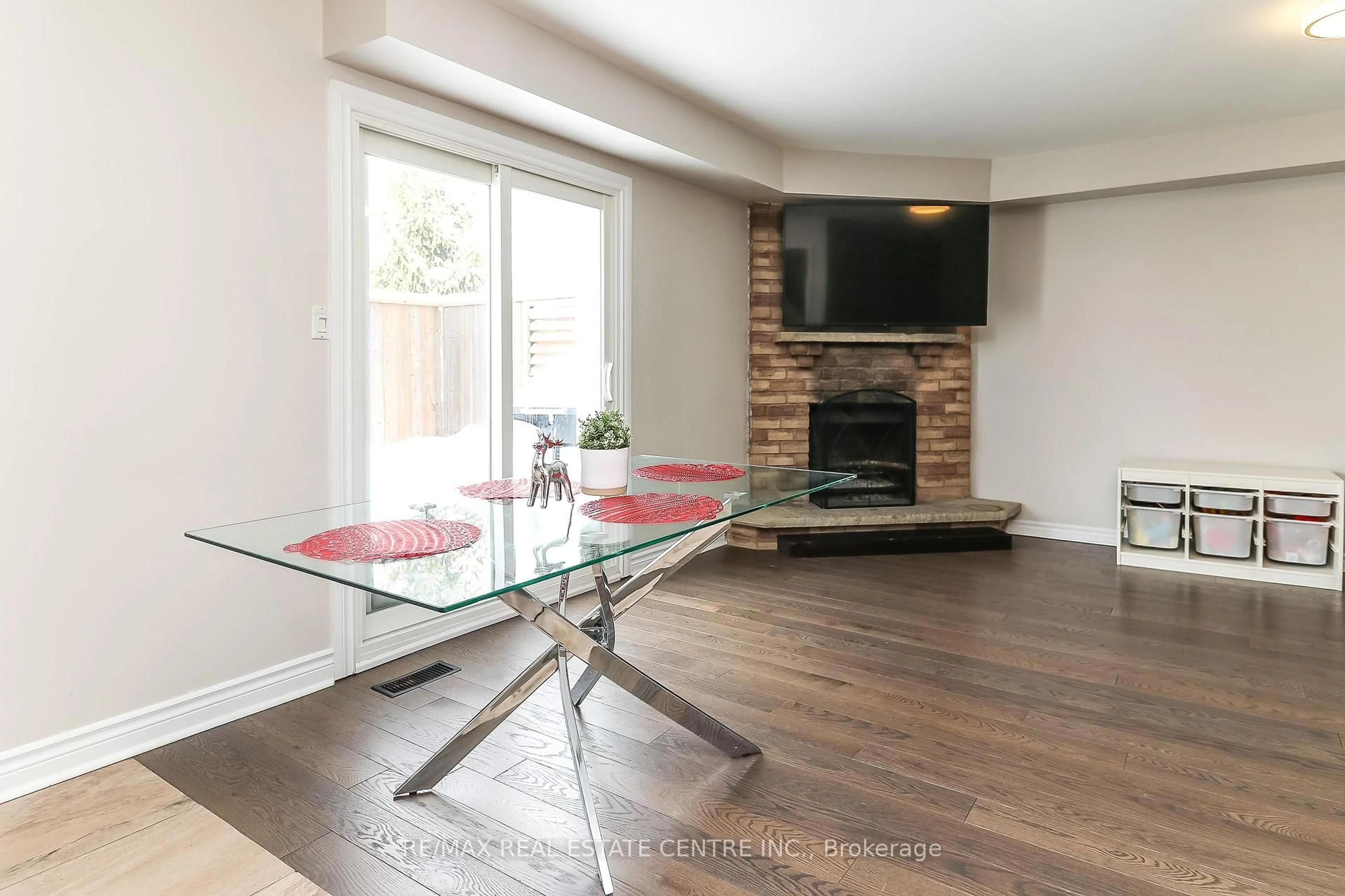 Living room with furniture, wood/laminate floor for 22 Meadowlark Rd, Barrie Ontario L4M 6C8
