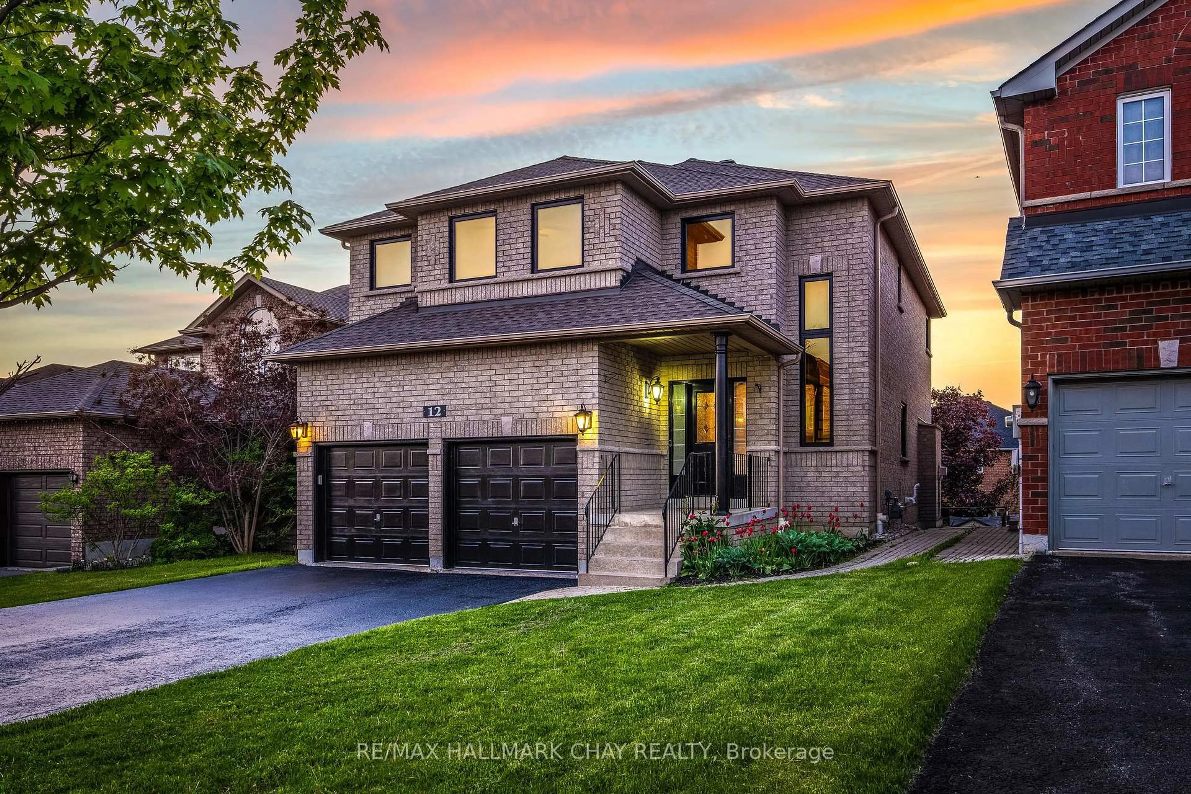 Home with brick exterior material, street for 12 Prince Of Wales Dr, Barrie Ontario L4N 0T5