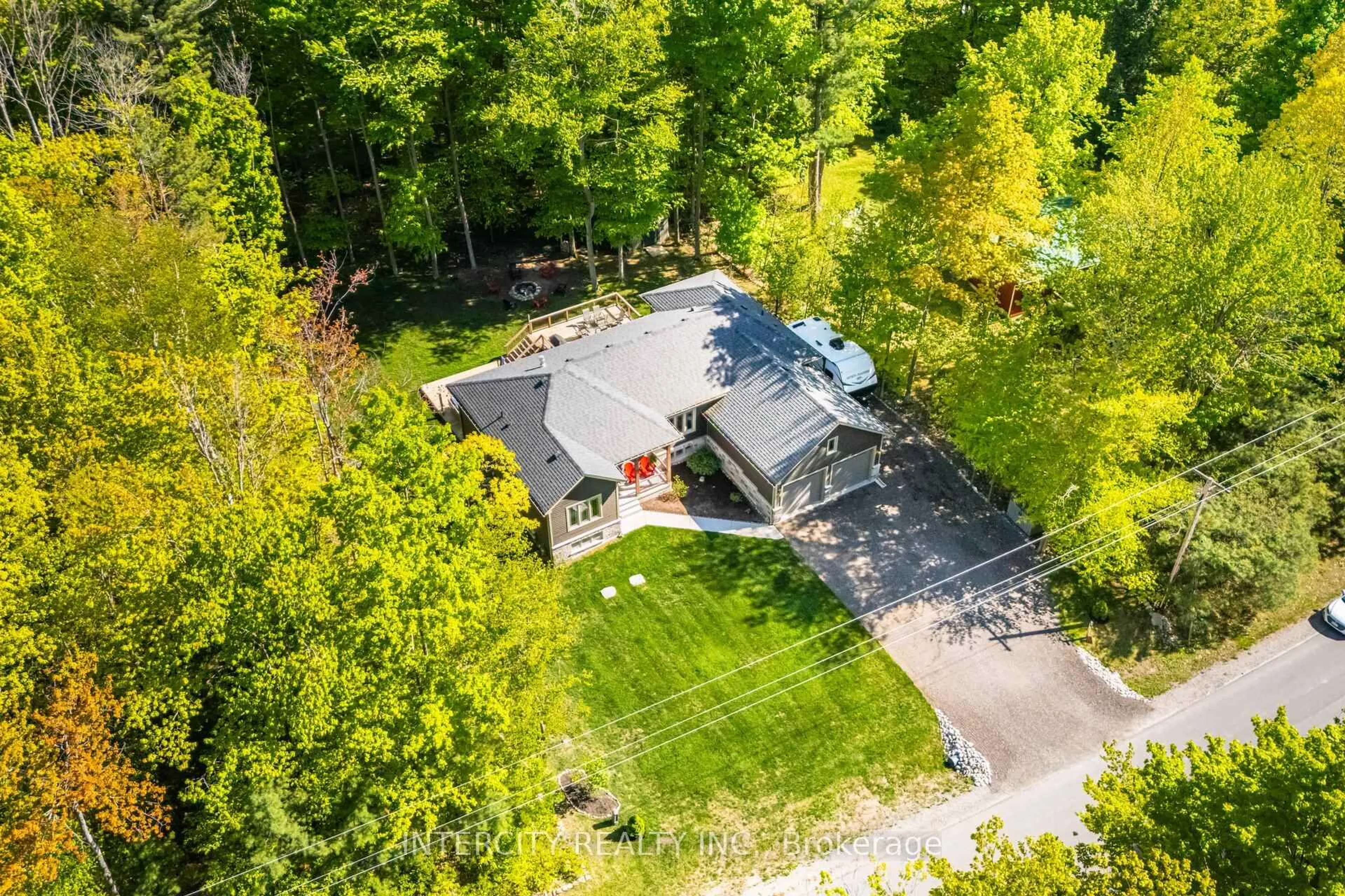 A pic from outside/outdoor area/front of a property/back of a property/a pic from drone, forest/trees view for 41 Tall Pines Dr, Tiny Ontario L9M 0H4