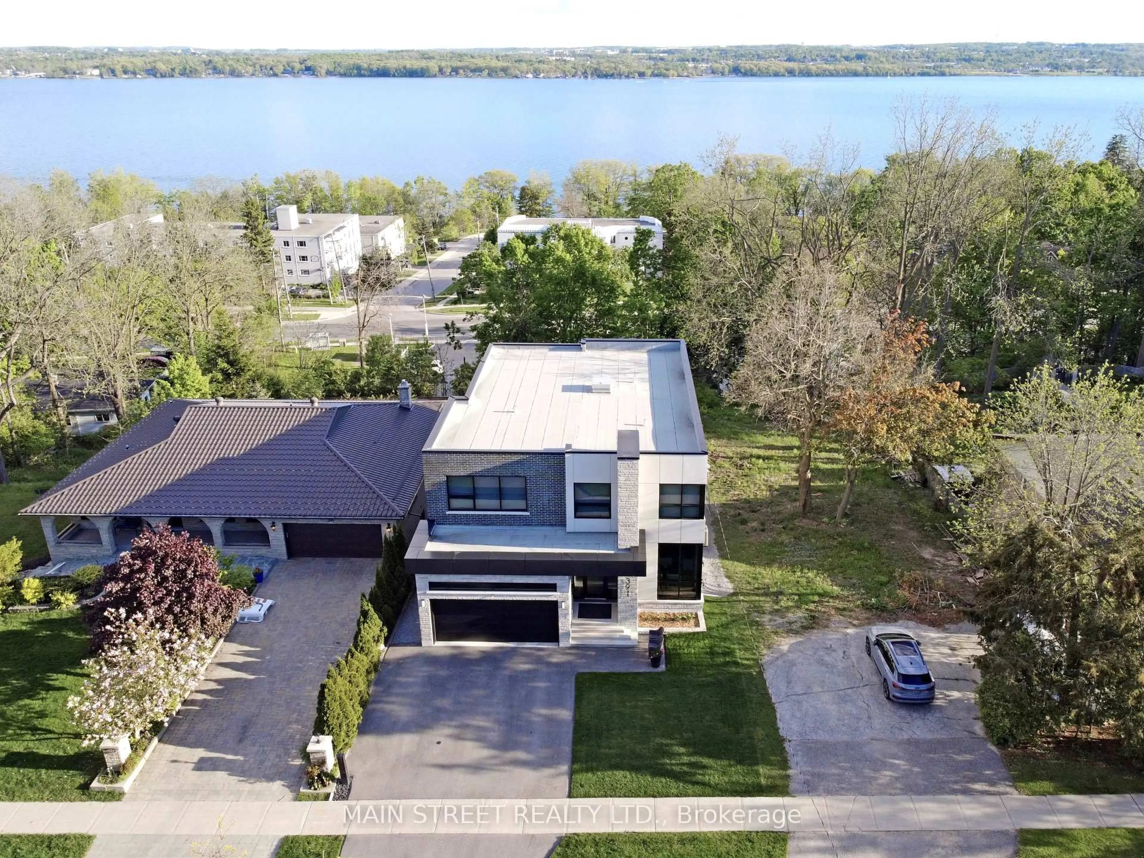 A pic from outside/outdoor area/front of a property/back of a property/a pic from drone, water/lake/river/ocean view for 391 Codrington St, Barrie Ontario L4M 1S9