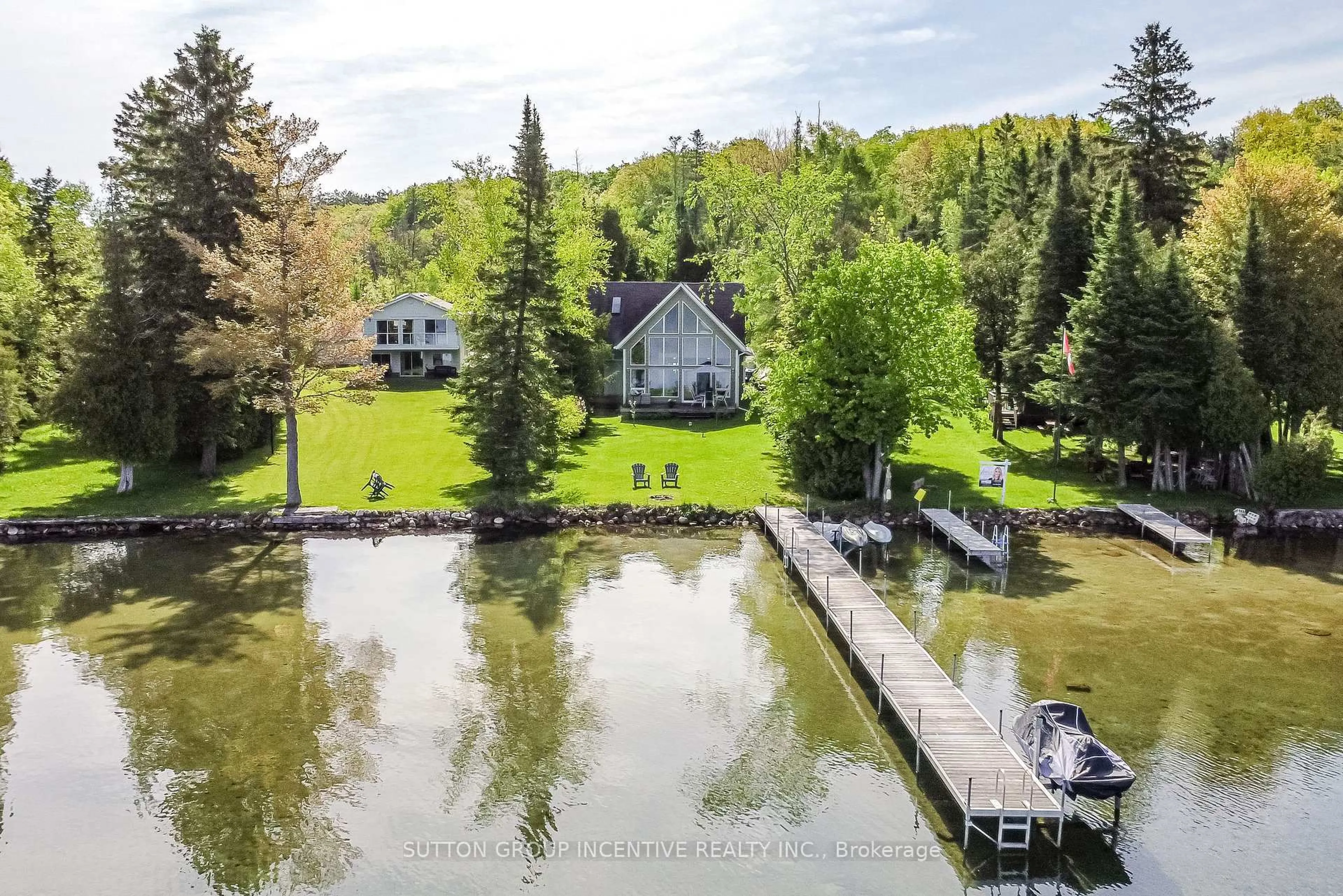 A pic from outside/outdoor area/front of a property/back of a property/a pic from drone, water/lake/river/ocean view for 10 Buttercup Lane, Springwater Ontario L0L 1P0