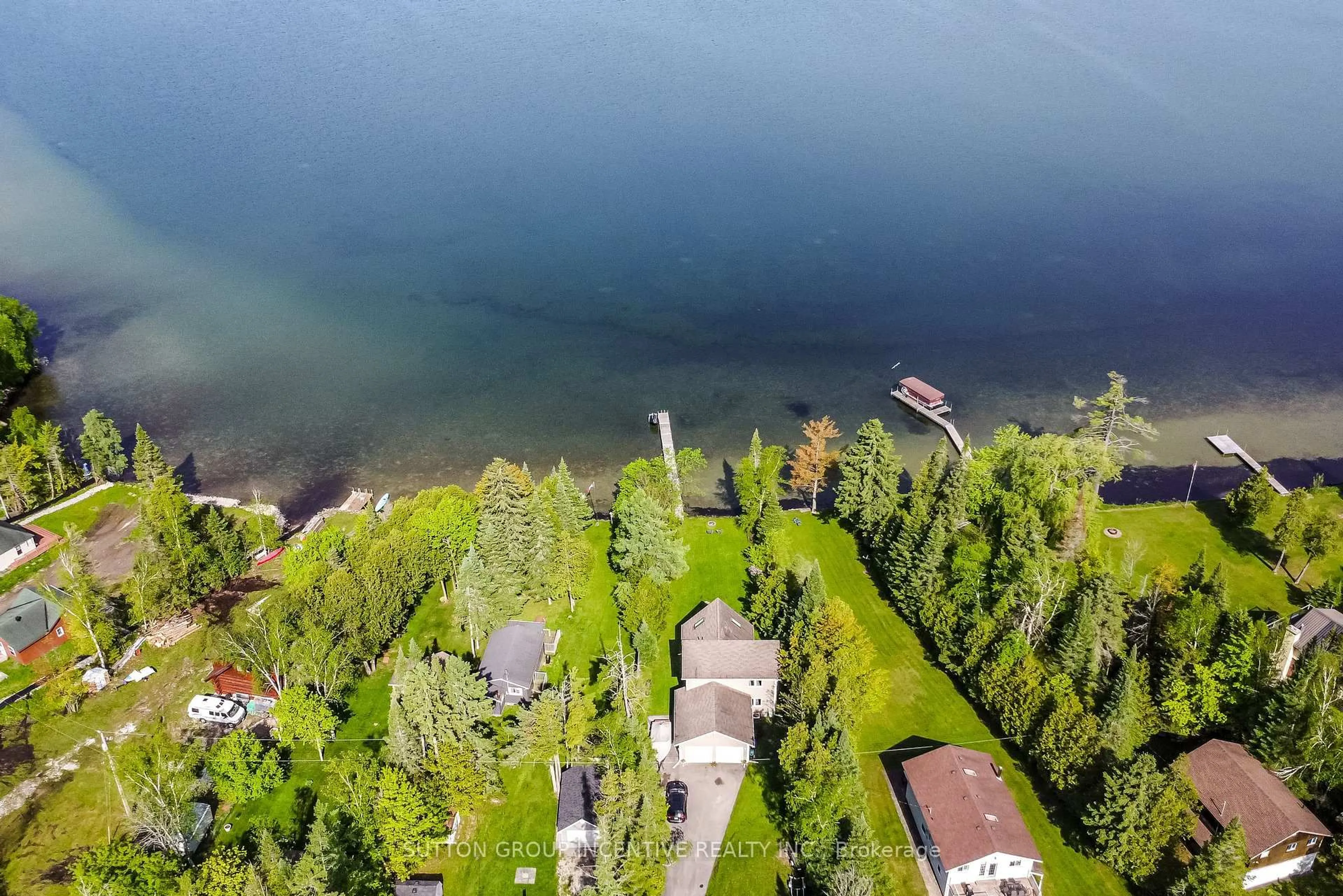 A pic from outside/outdoor area/front of a property/back of a property/a pic from drone, water/lake/river/ocean view for 10 Buttercup Lane, Springwater Ontario L0L 1P0