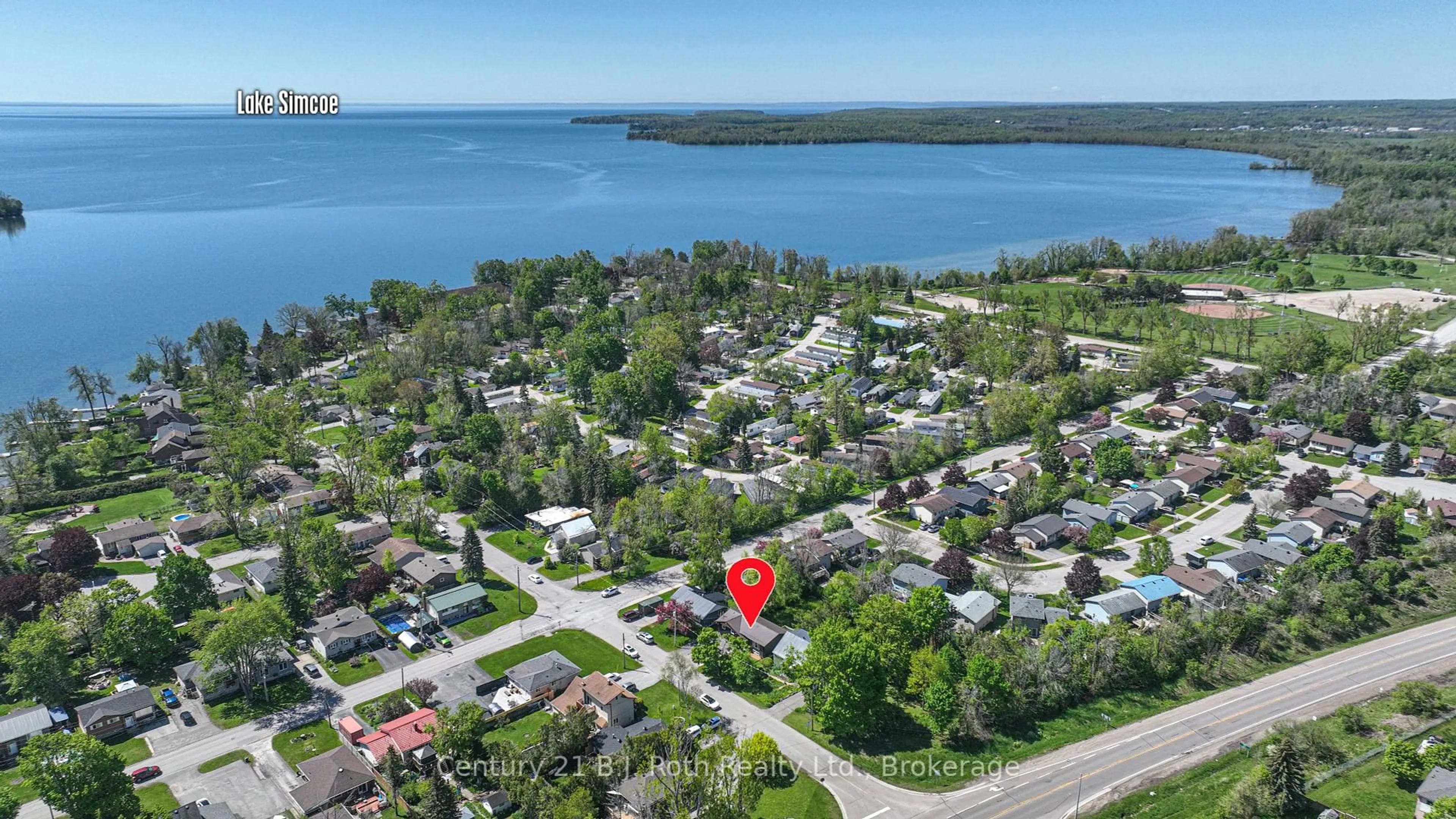 A pic from outside/outdoor area/front of a property/back of a property/a pic from drone, water/lake/river/ocean view for 571 High St, Orillia Ontario L3V 4Y2