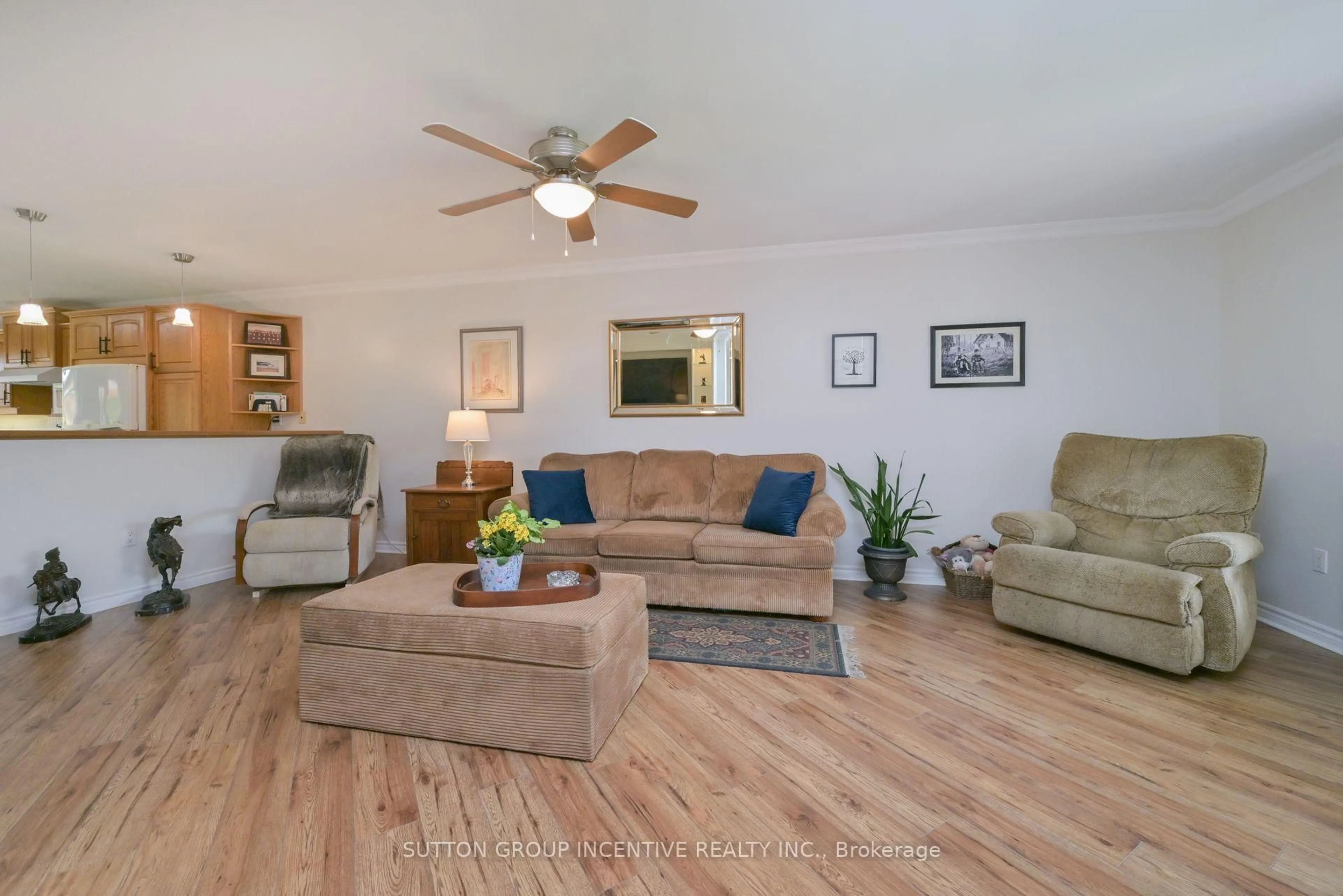 Living room with furniture, wood/laminate floor for 107 Huronia Rd, Barrie Ontario L4N 4G1