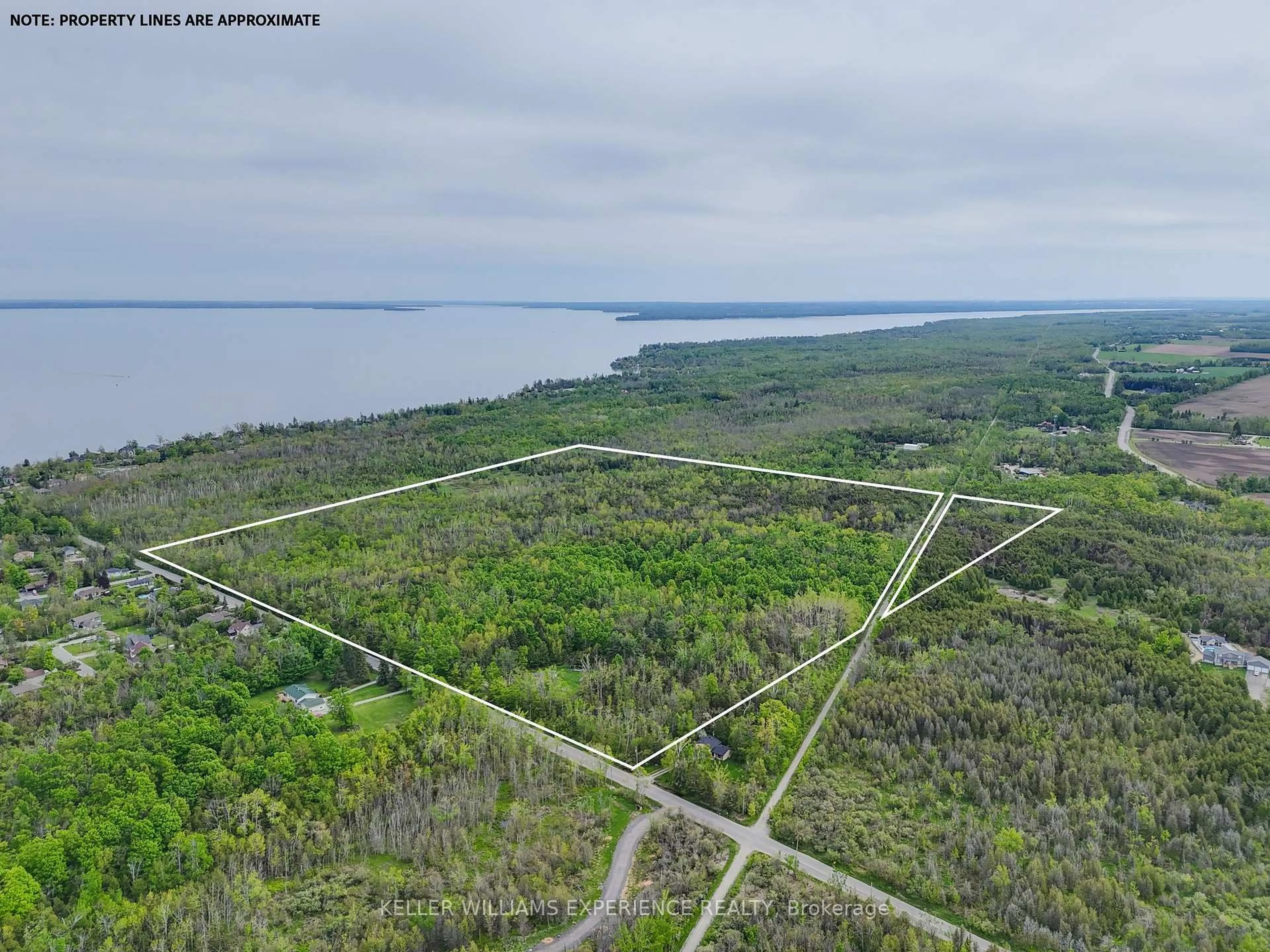 A pic from outside/outdoor area/front of a property/back of a property/a pic from drone, water/lake/river/ocean view for 552 10 Line, Oro-Medonte Ontario L0L 1T0