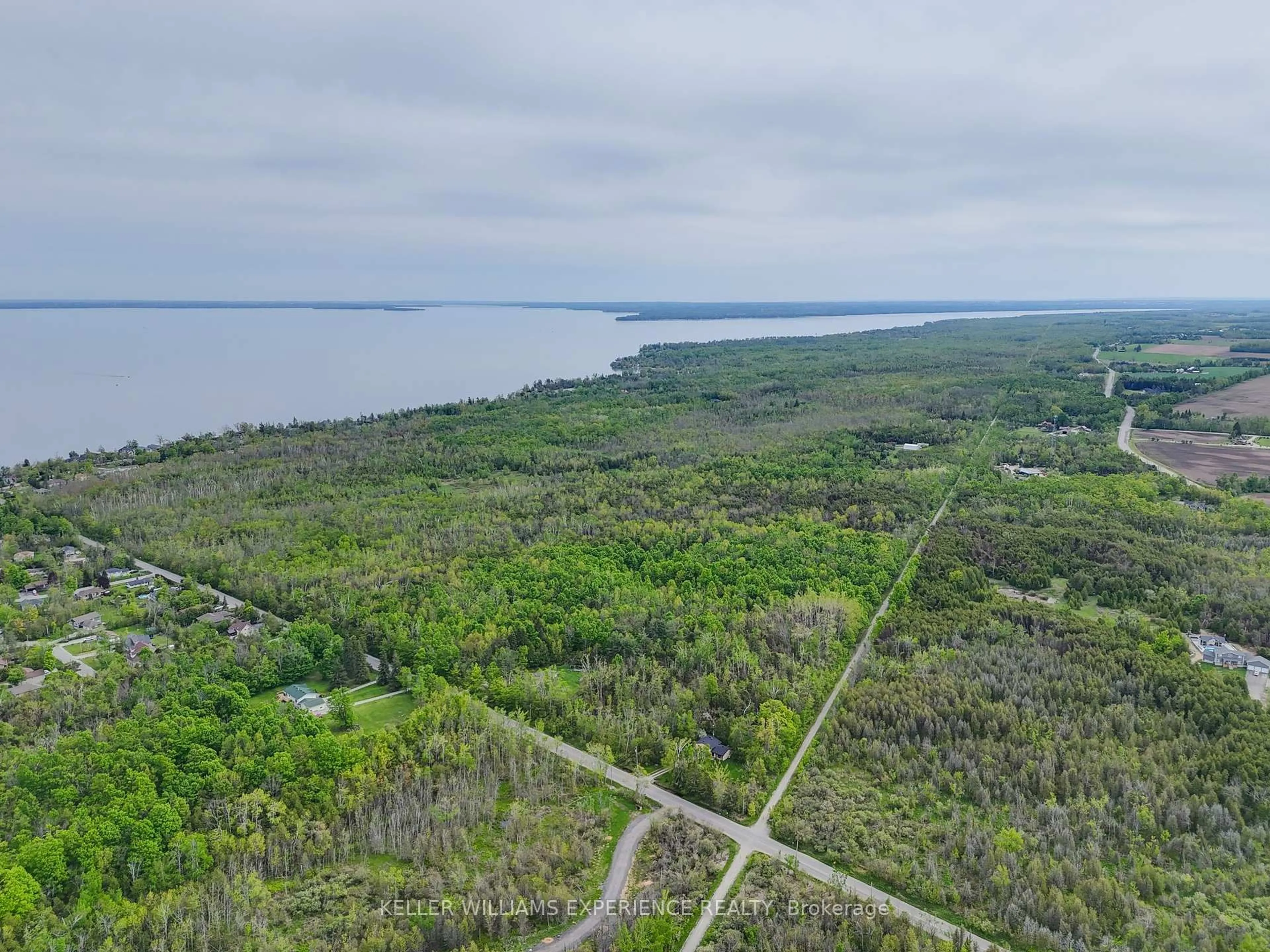 A pic from outside/outdoor area/front of a property/back of a property/a pic from drone, water/lake/river/ocean view for 552 10 Line, Oro-Medonte Ontario L0L 1T0