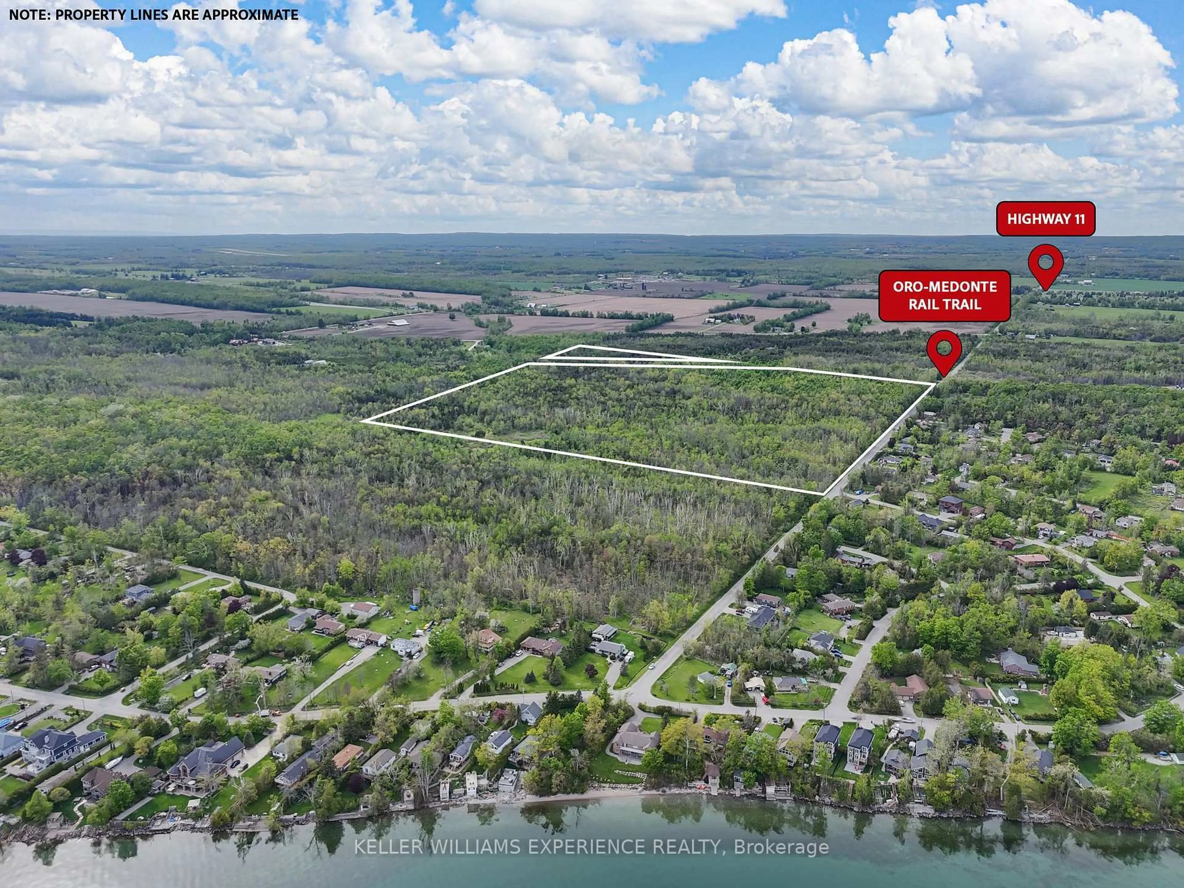 A pic from outside/outdoor area/front of a property/back of a property/a pic from drone, water/lake/river/ocean view for 552 10 Line, Oro-Medonte Ontario L0L 1T0