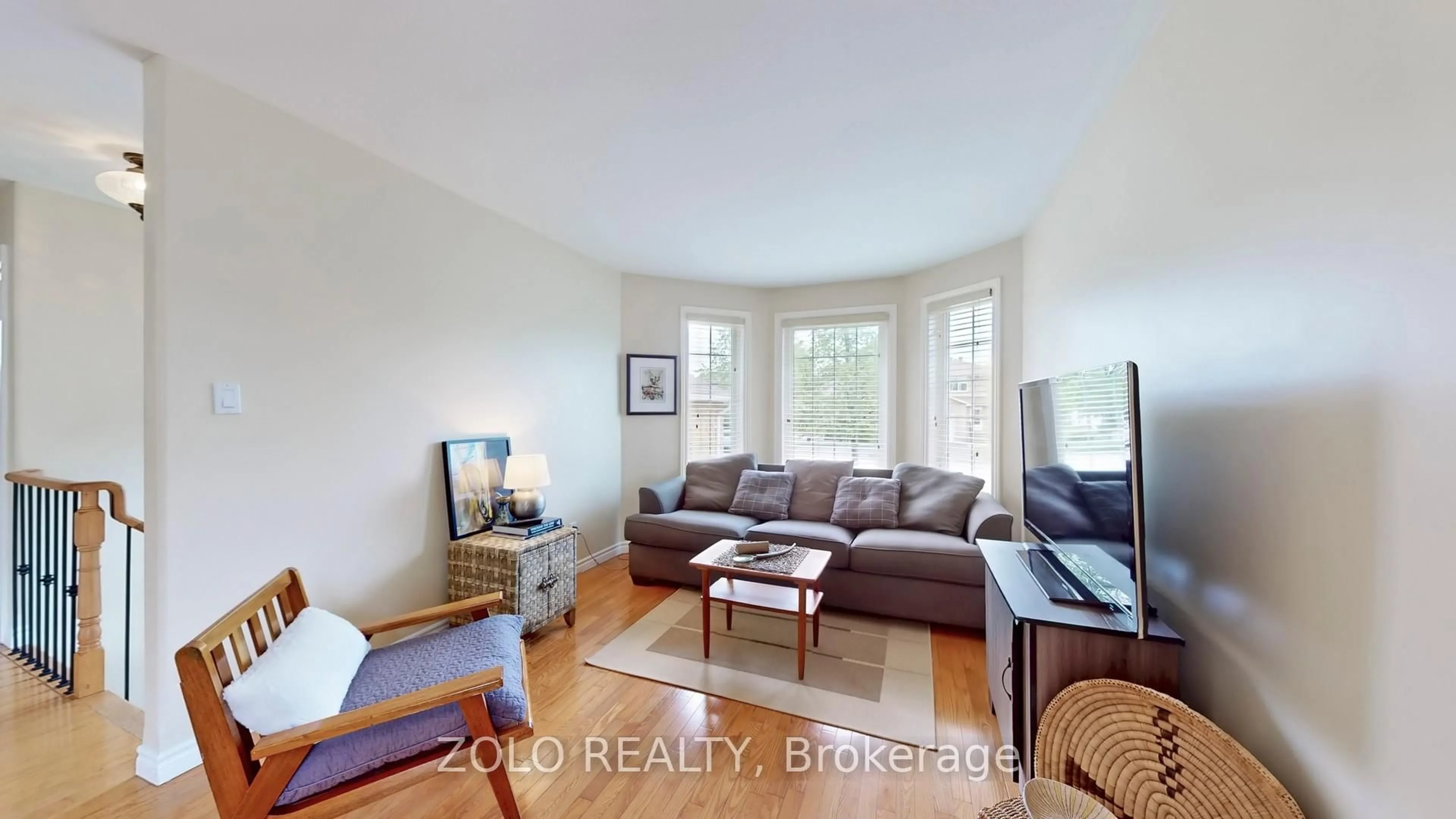 Living room with furniture, wood/laminate floor for 7 Golden Eagle Way, Barrie Ontario L4M 6P6