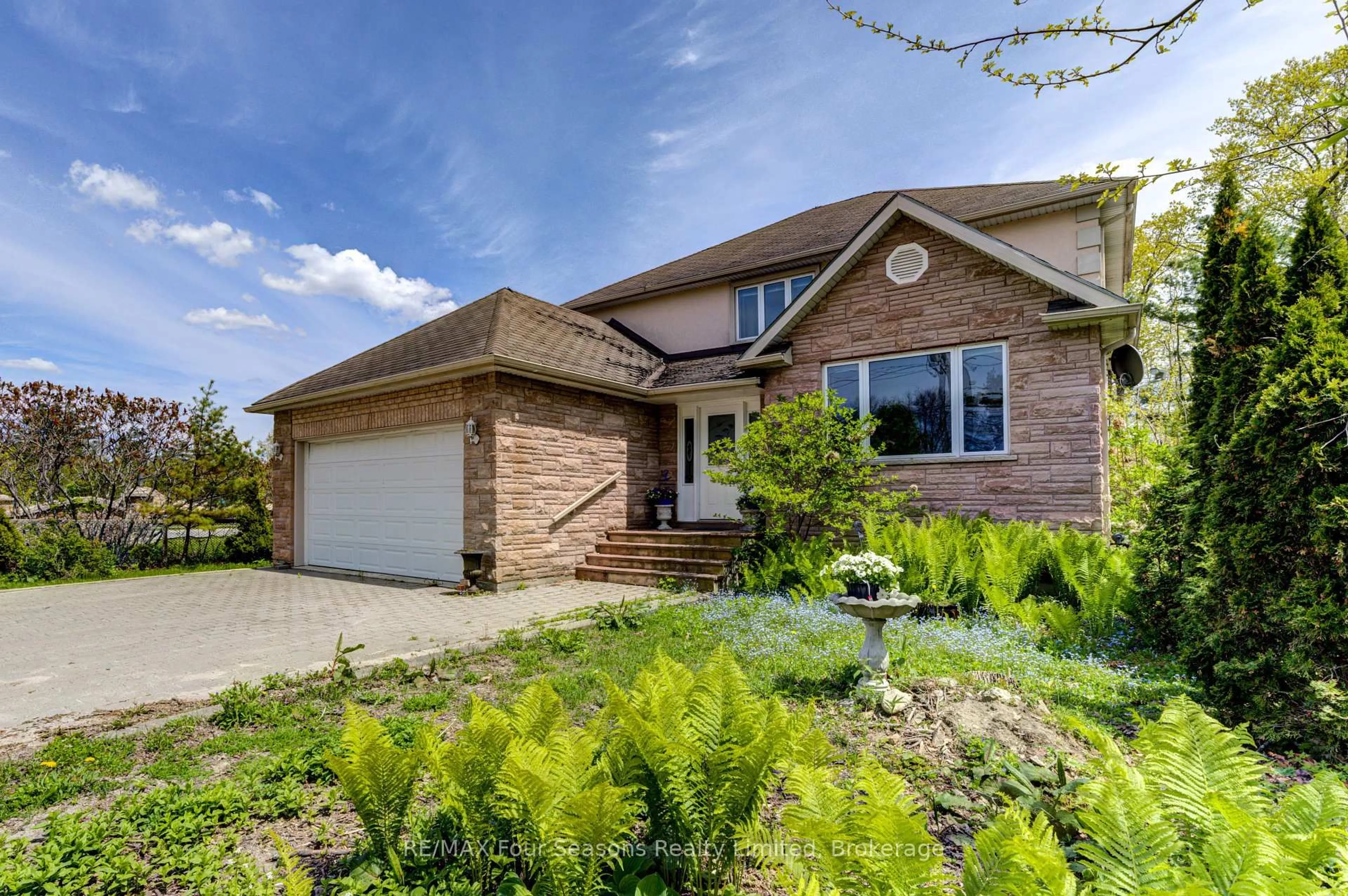 Home with brick exterior material, street for 243 River Rd, Wasaga Beach Ontario L9Z 2L1