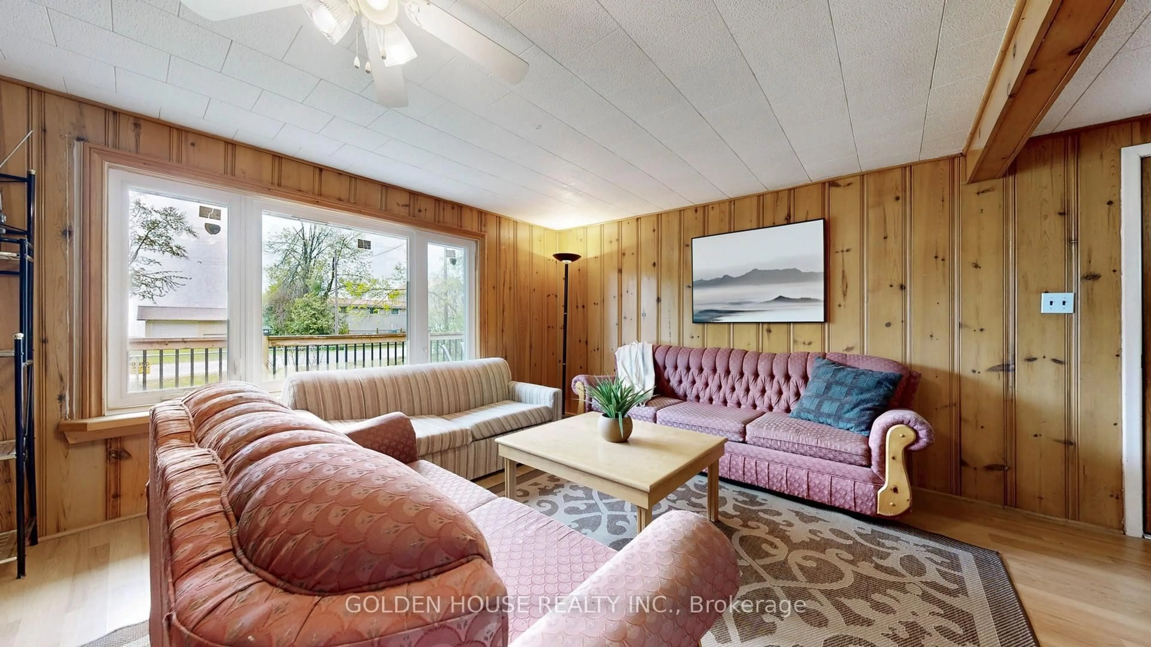 Living room with furniture, wood/laminate floor for 3845 Glenrest Dr, Ramara Ontario L0K 1B0