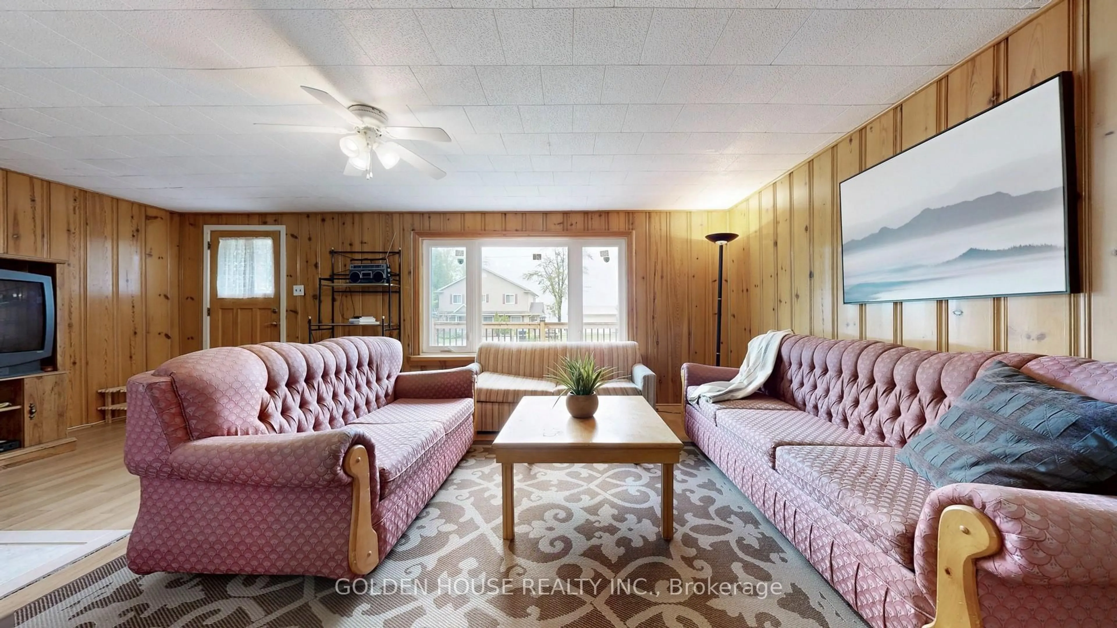 Living room with furniture, wood/laminate floor for 3845 Glenrest Dr, Ramara Ontario L0K 1B0