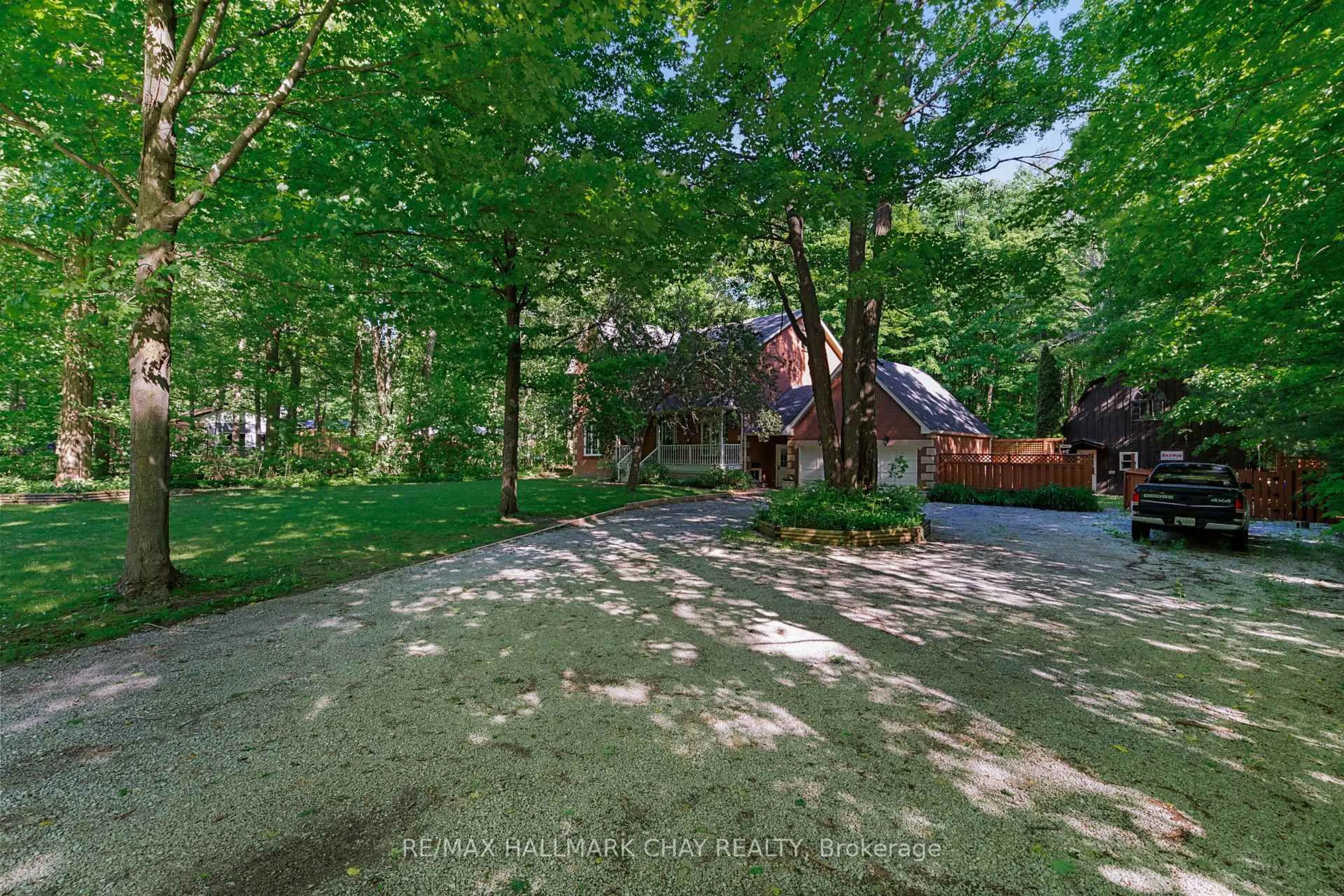 A pic from outside/outdoor area/front of a property/back of a property/a pic from drone, forest/trees view for 1311 Snow Valley Rd, Springwater Ontario L9X 1K2