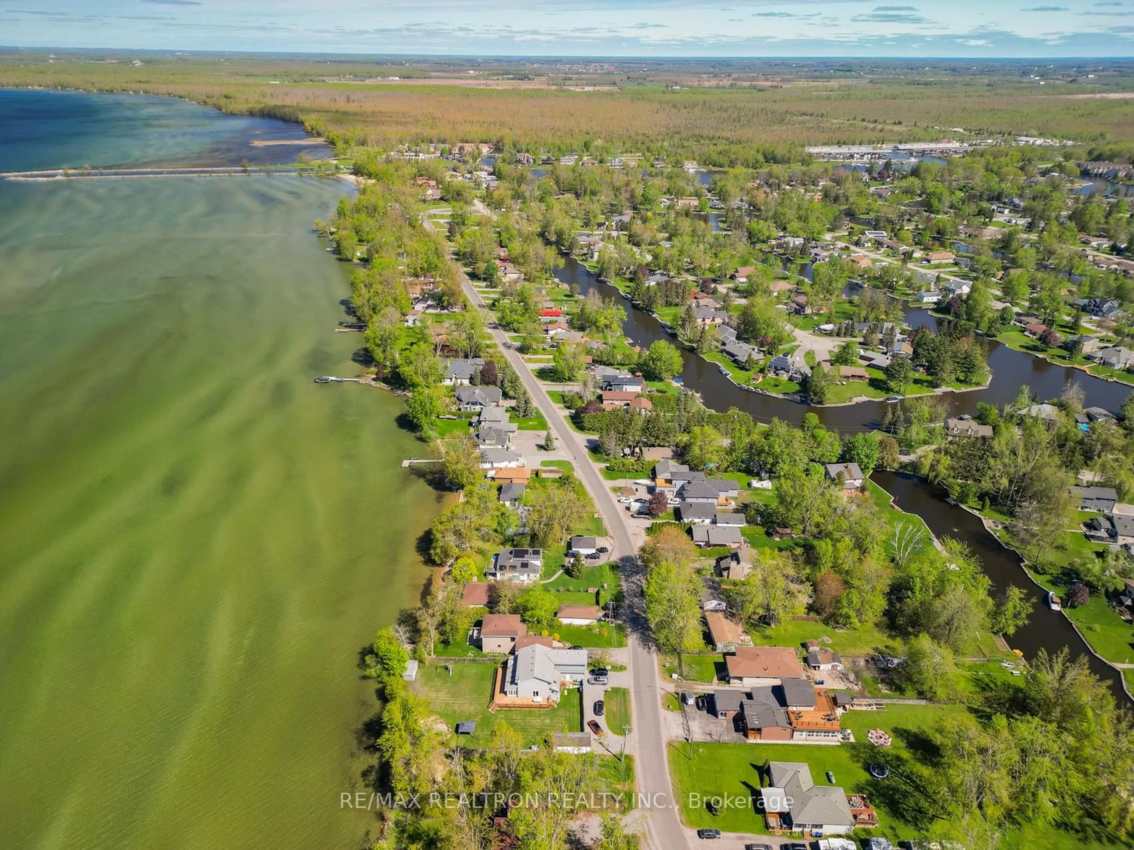 A pic from outside/outdoor area/front of a property/back of a property/a pic from drone, water/lake/river/ocean view for 31 Lake Ave, Ramara Ontario L0K 1B0