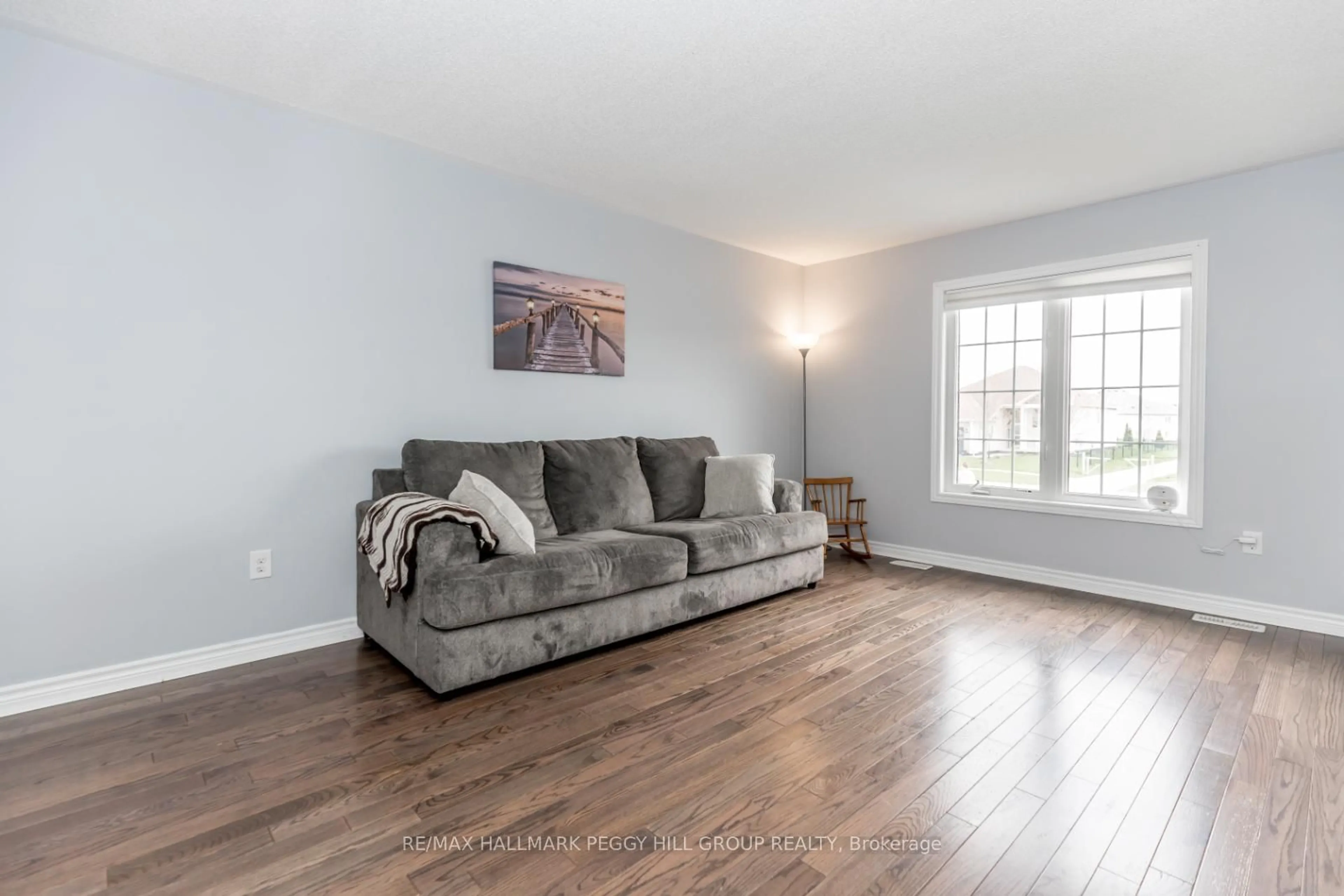 Living room with furniture, wood/laminate floor for 283 Regina St, Clearview Ontario L0M 1S0