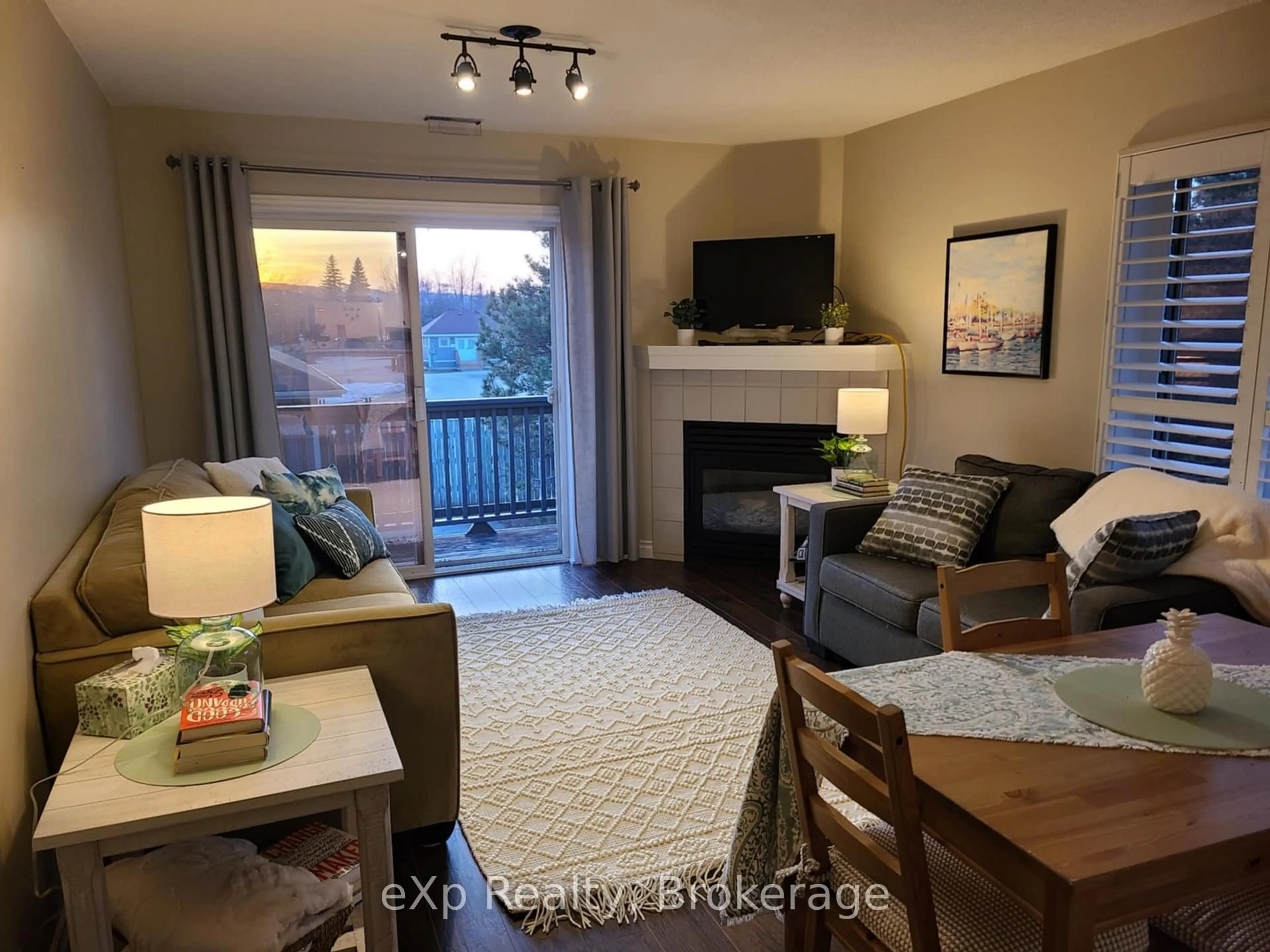 Living room with furniture, wood/laminate floor for 337 Mariners Way, Collingwood Ontario L9Y 5C7