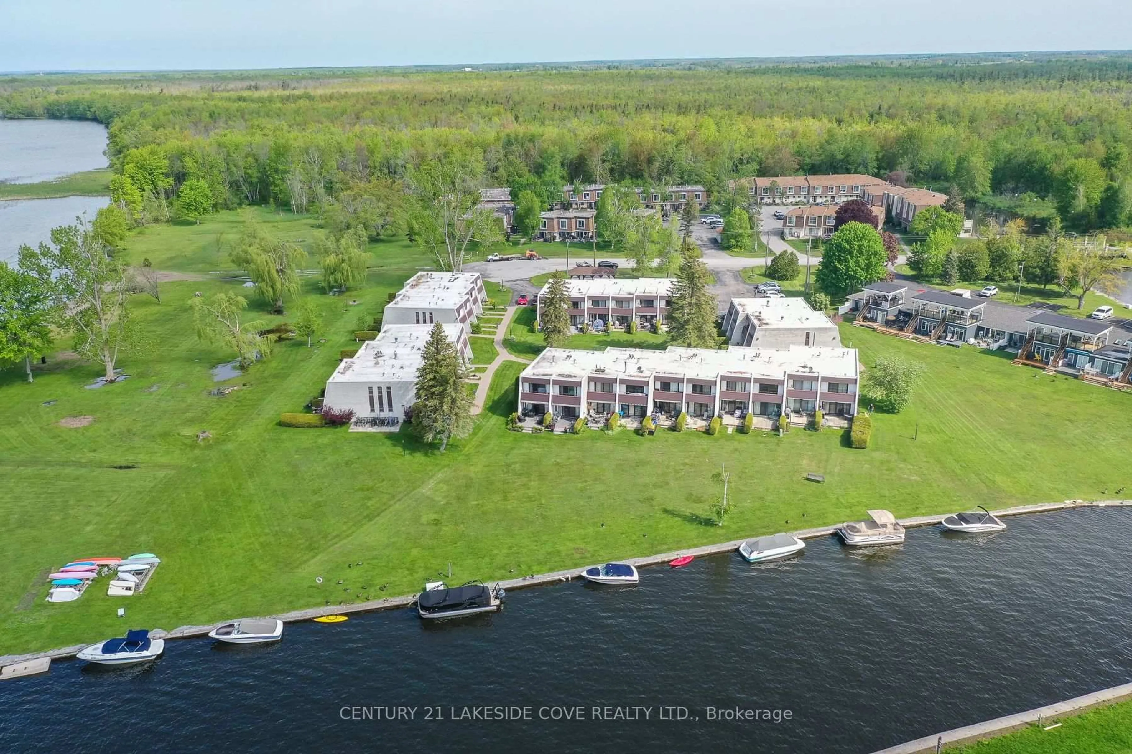 A pic from outside/outdoor area/front of a property/back of a property/a pic from drone, water/lake/river/ocean view for 1 Paradise Blvd #Unit 14, Ramara Ontario L0K 1B0