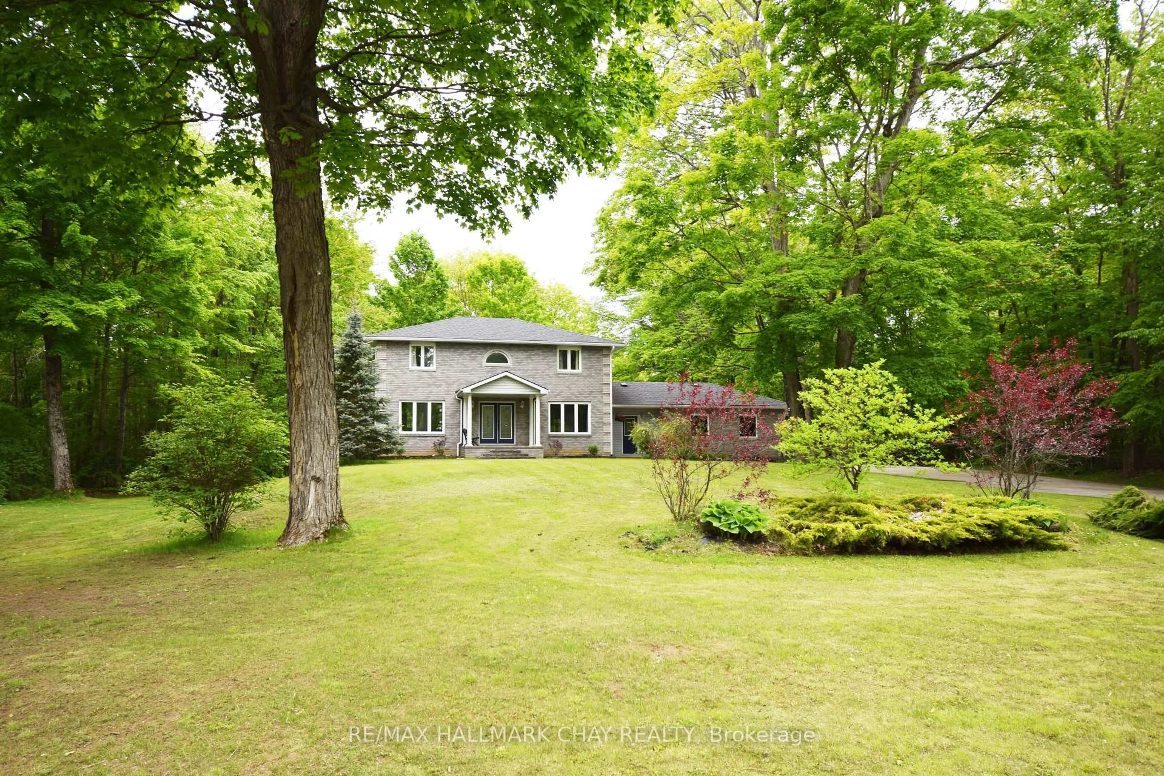 A pic from outside/outdoor area/front of a property/back of a property/a pic from drone, forest/trees view for 5810 Lowanda Lane, Ramara Ontario L0K 1W0