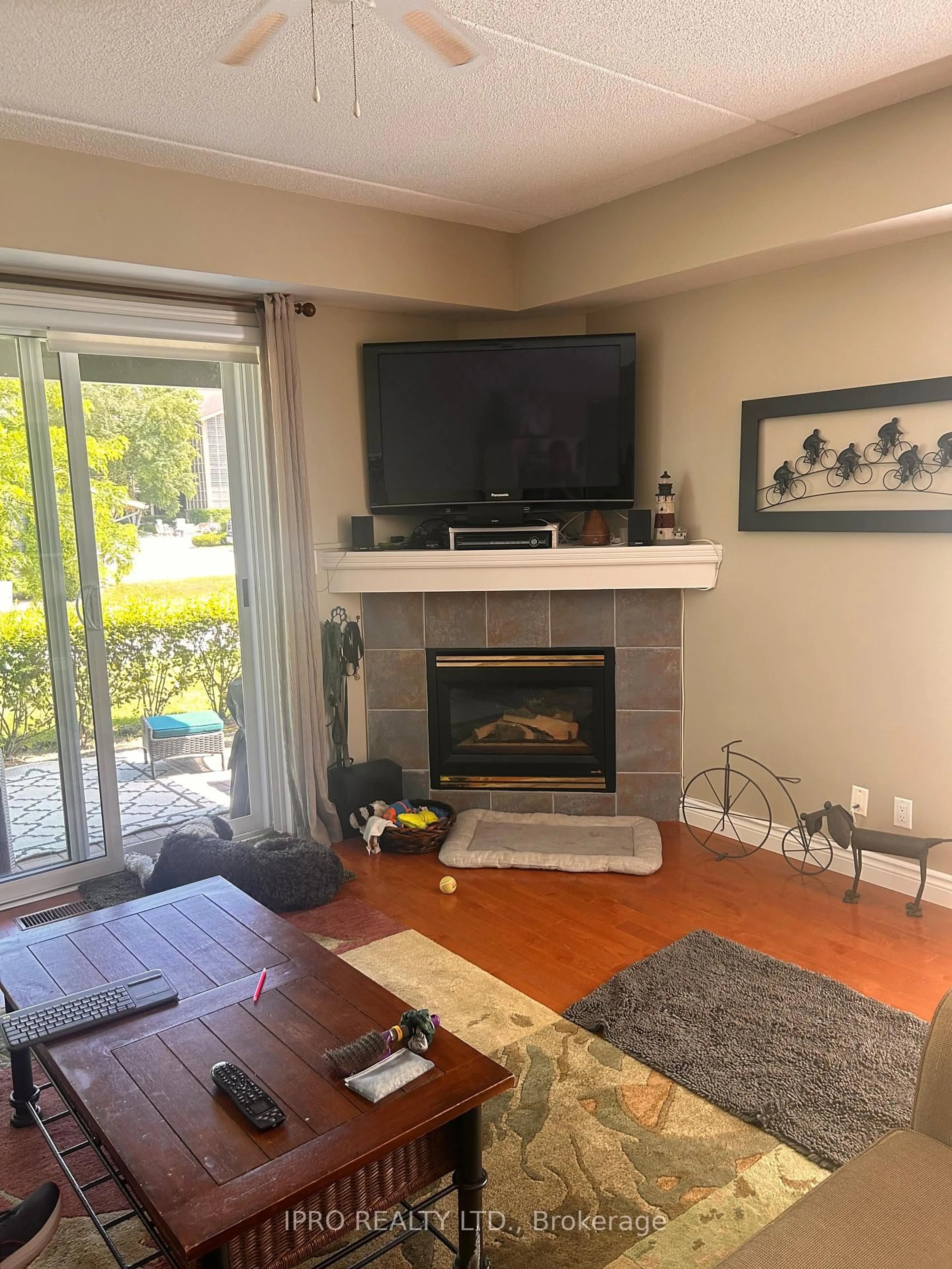Living room with furniture, wood/laminate floor for 445 Mariners Way #8, Collingwood Ontario L9Y 5C7