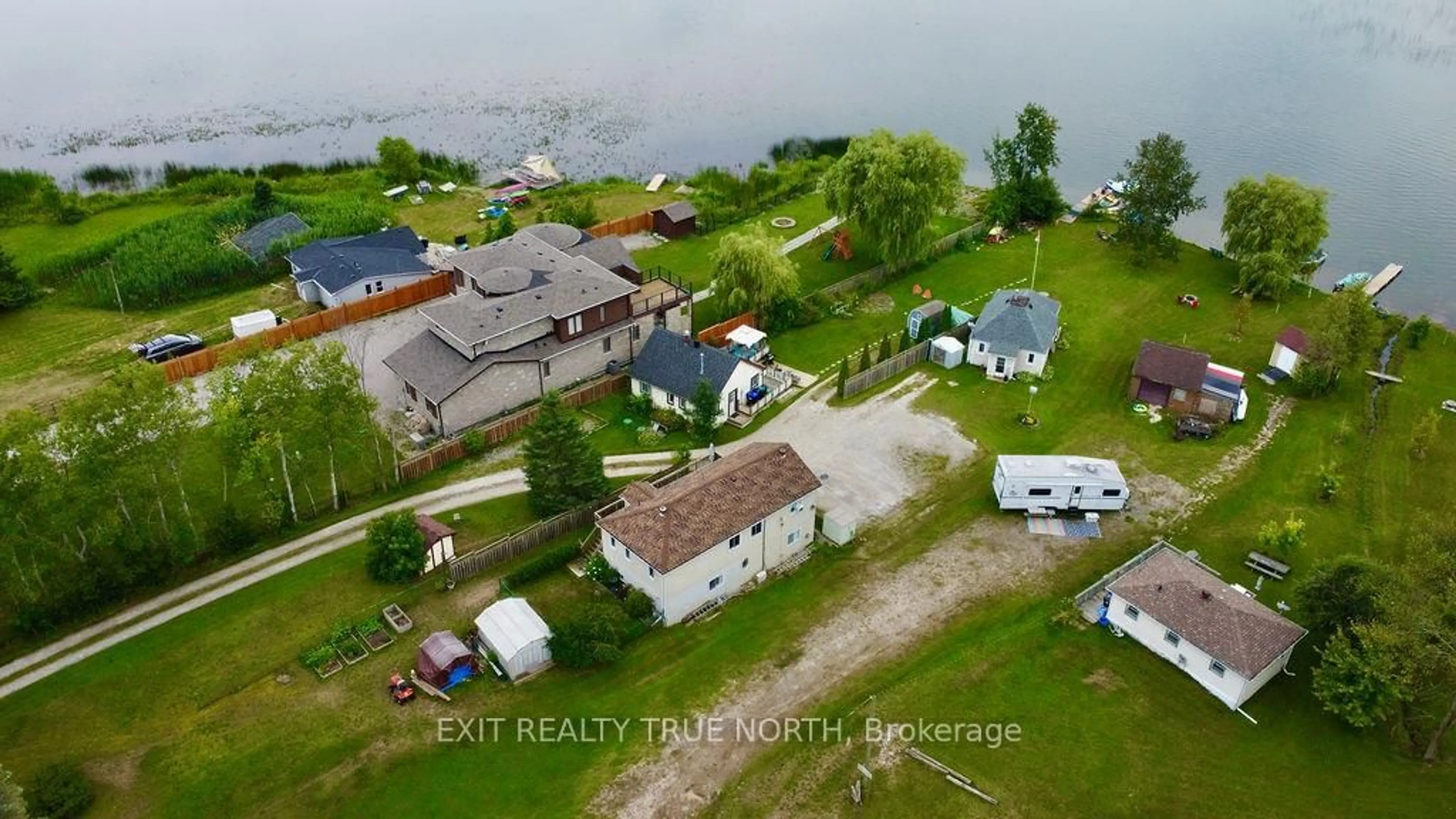 A pic from outside/outdoor area/front of a property/back of a property/a pic from drone, water/lake/river/ocean view for 5632 Penetanguishene Rd, Springwater Ontario L0L 1P0