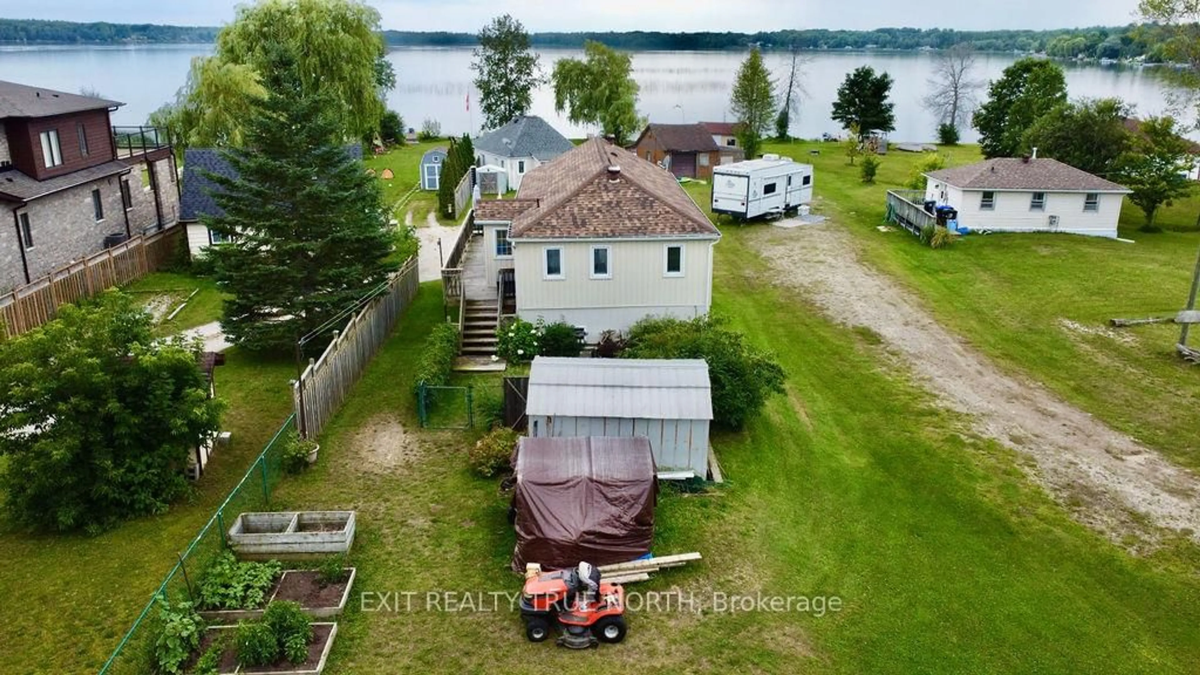A pic from outside/outdoor area/front of a property/back of a property/a pic from drone, water/lake/river/ocean view for 5632 Penetanguishene Rd, Springwater Ontario L0L 1P0