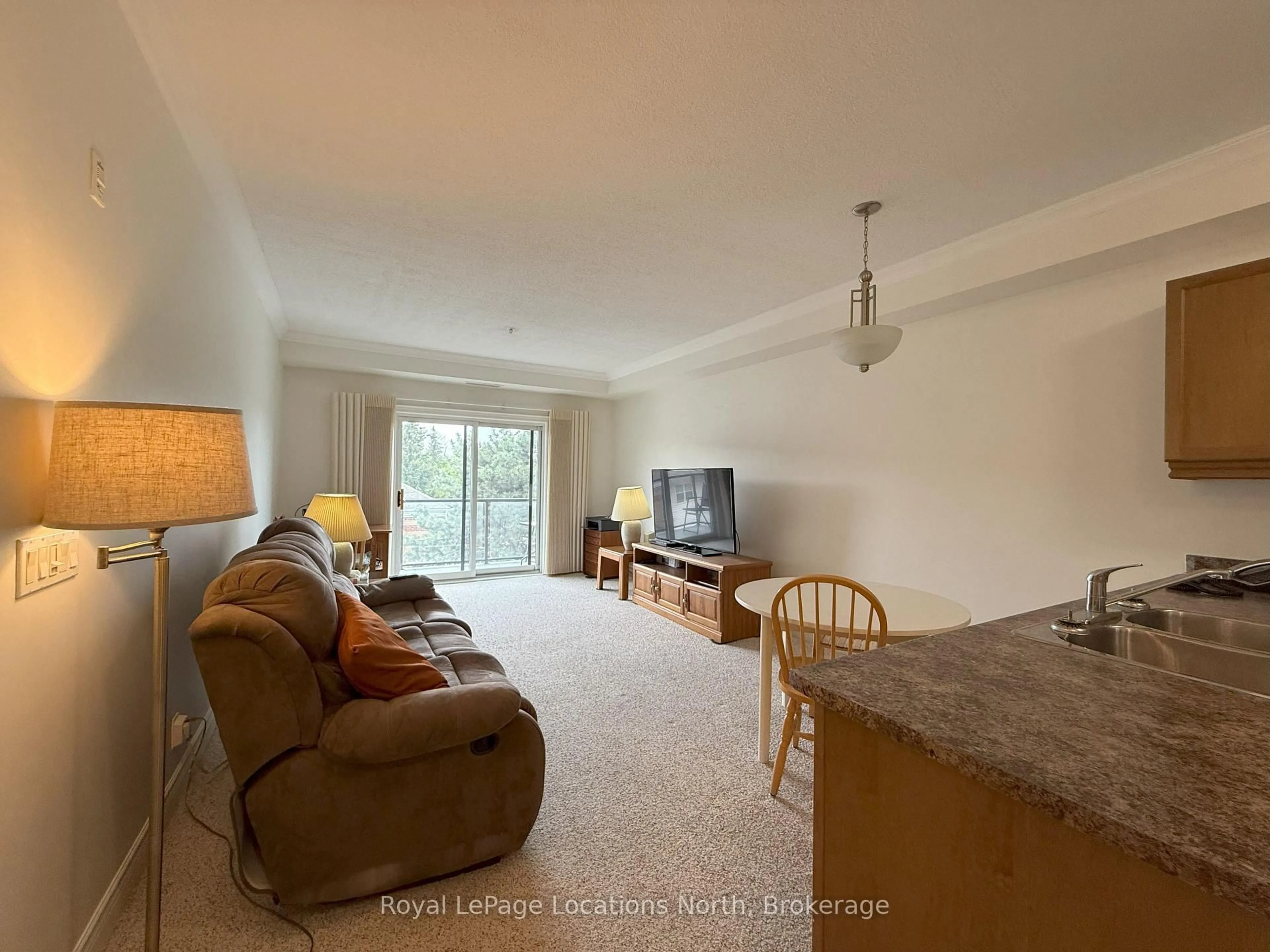 Living room with furniture, unknown for 91 RAGLAN St #303, Collingwood Ontario L9Y 4V3
