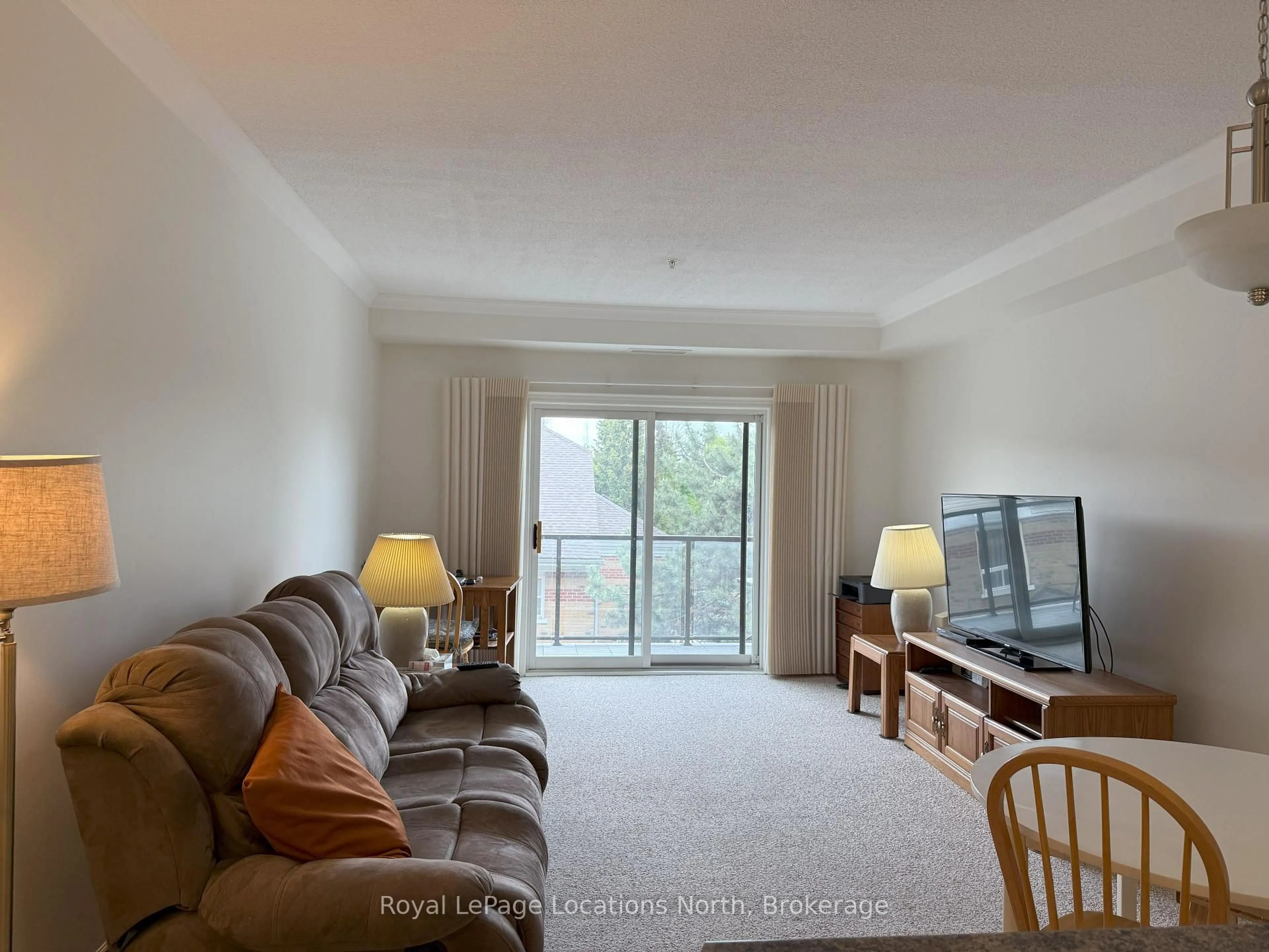 Living room with furniture, unknown for 91 RAGLAN St #303, Collingwood Ontario L9Y 4V3