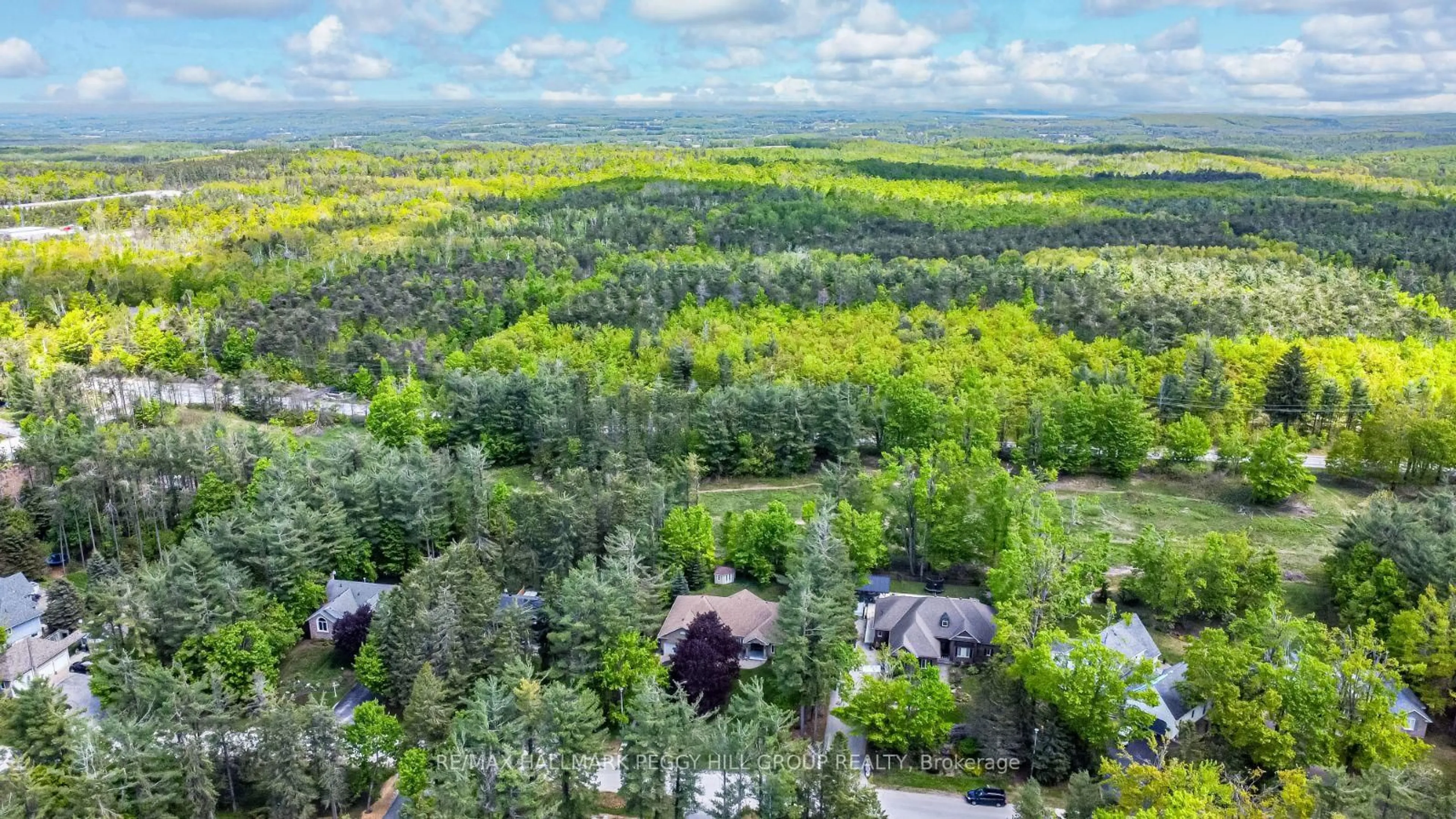 A pic from outside/outdoor area/front of a property/back of a property/a pic from drone, forest/trees view for 9 Fairway Crt, Oro-Medonte Ontario L0L 2L0
