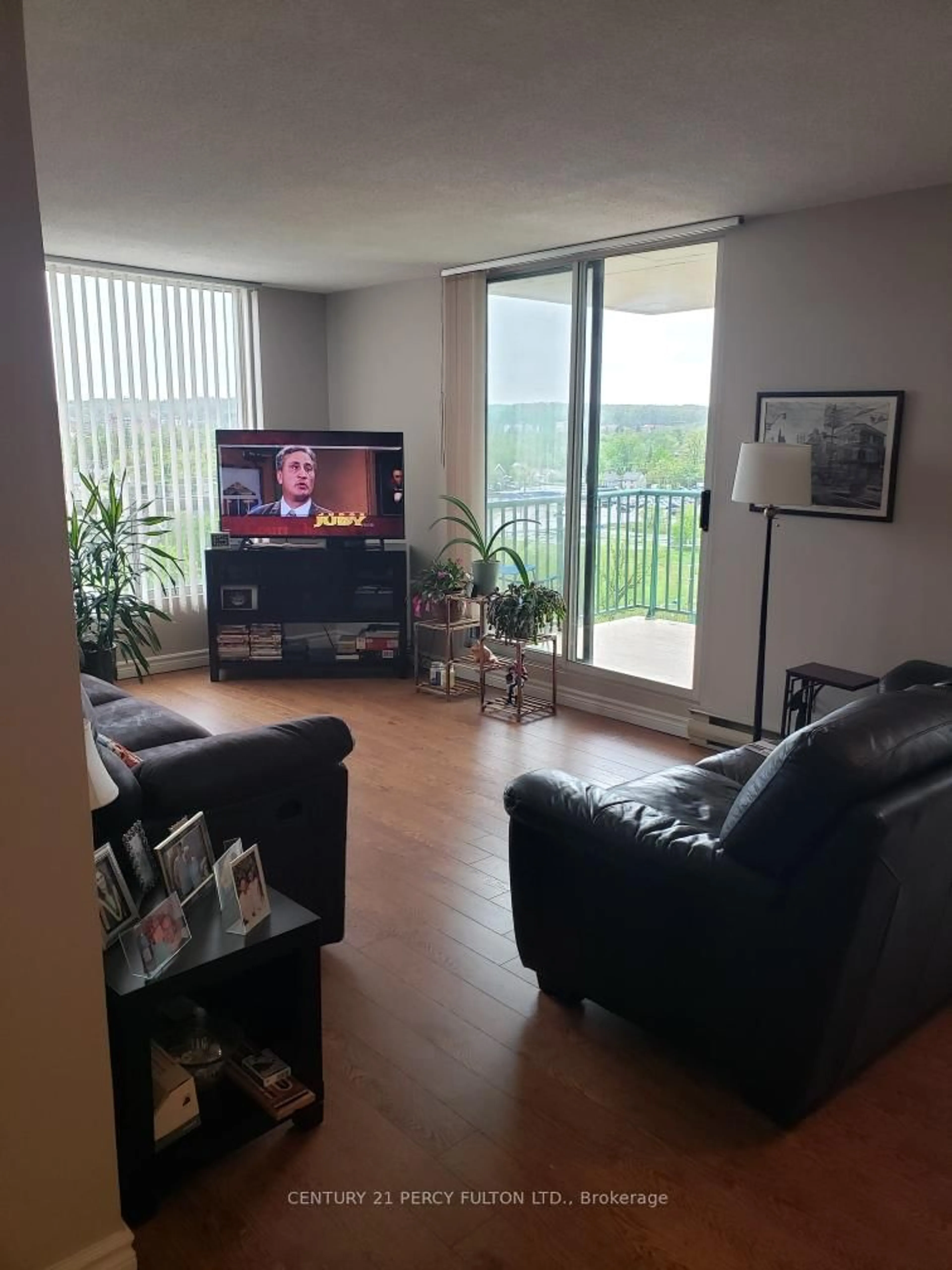 Living room with furniture, unknown for 75 Ellen St #1004, Barrie Ontario L4N 7R6