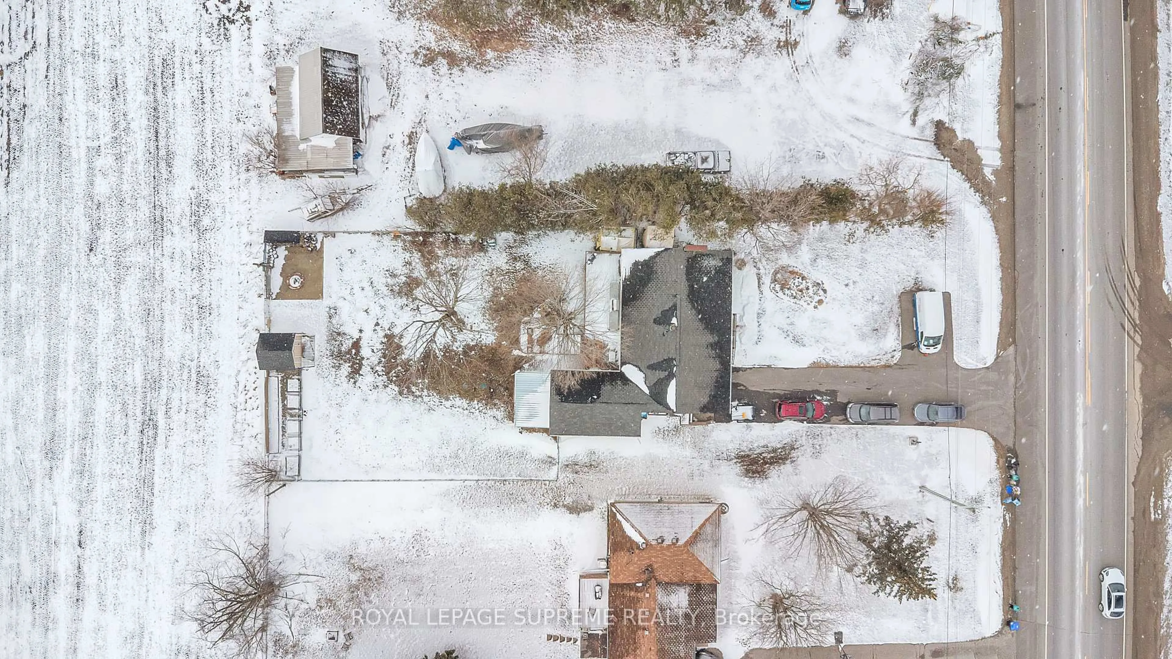 A pic from outside/outdoor area/front of a property/back of a property/a pic from drone, street for 8740 12 Highway, Oro-Medonte Ontario L3V 6H2