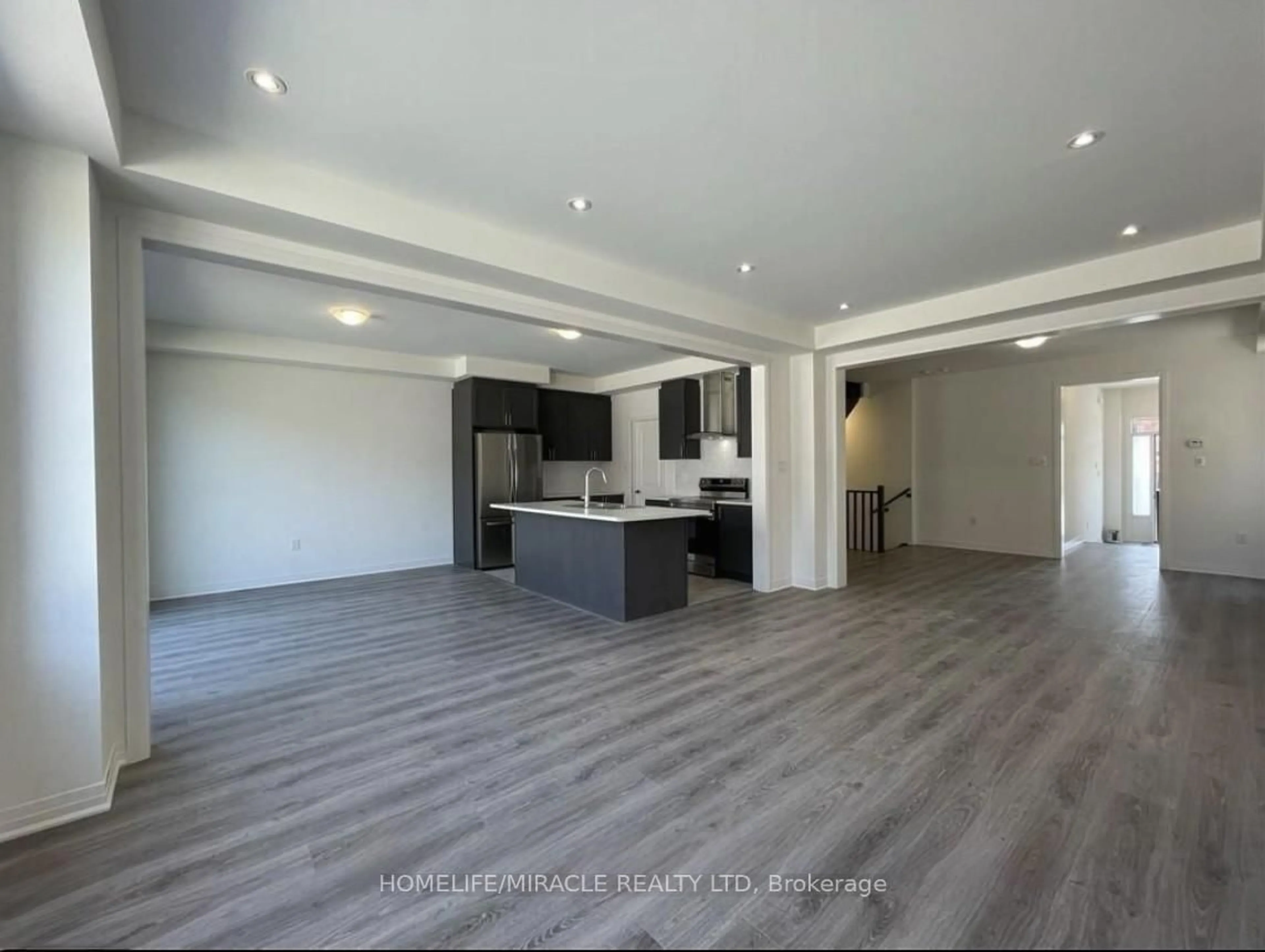 Open concept kitchen, wood/laminate floor for 63 Shepherd Dr, Barrie Ontario L9J 0K4