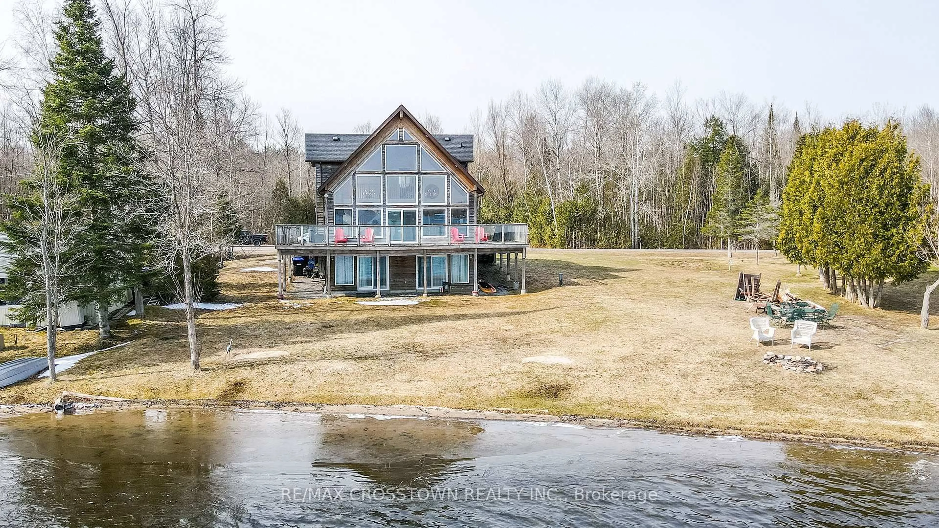 A pic from outside/outdoor area/front of a property/back of a property/a pic from drone, water/lake/river/ocean view for 3093 Sandy Bend, Springwater Ontario L0L 1P0
