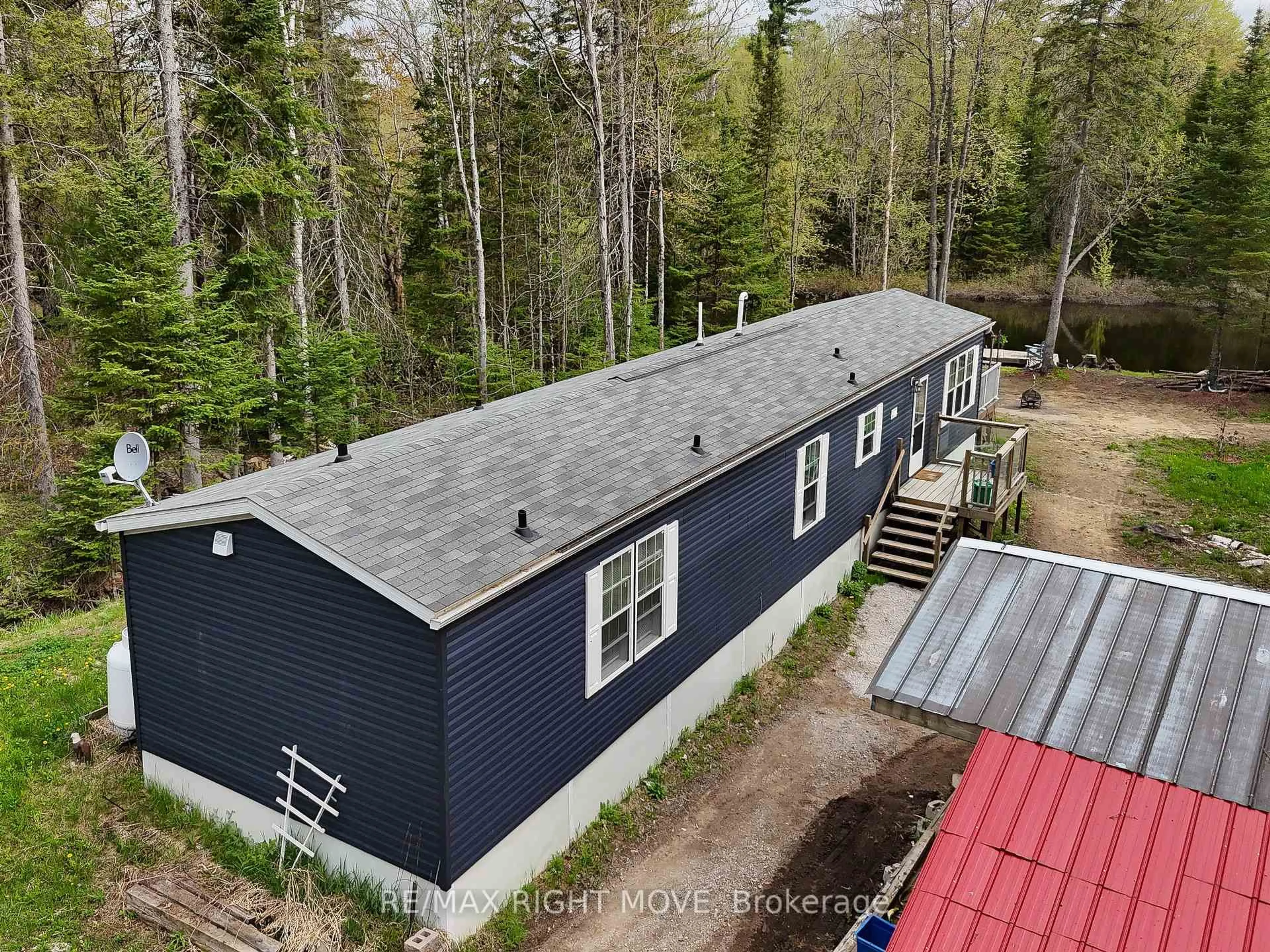 A pic from outside/outdoor area/front of a property/back of a property/a pic from drone, unknown for 6593 Pioneer Village Lane, Ramara Ontario L0K 1W0