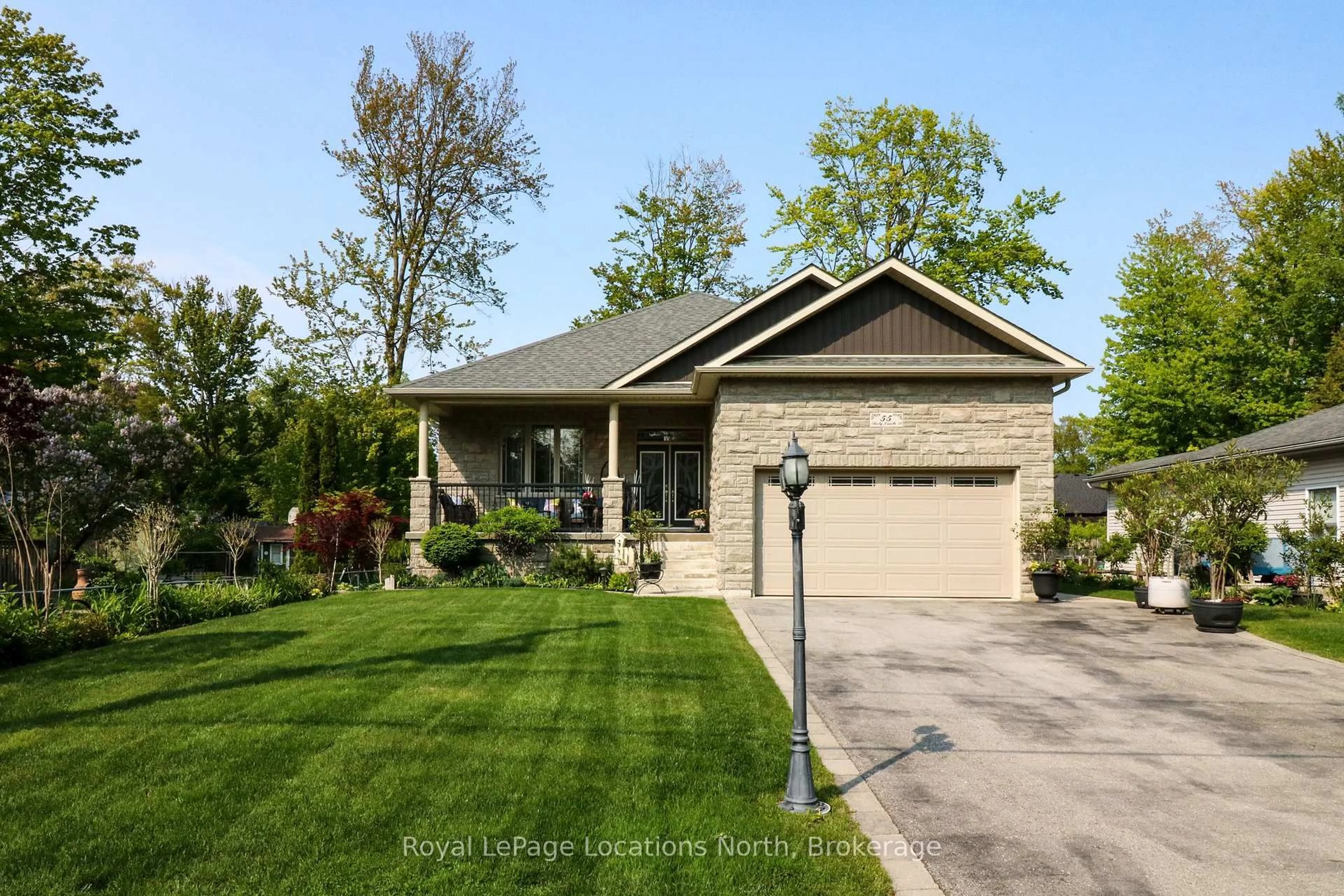 Home with brick exterior material, street for 55 34th St, Wasaga Beach Ontario L9Z 2C2