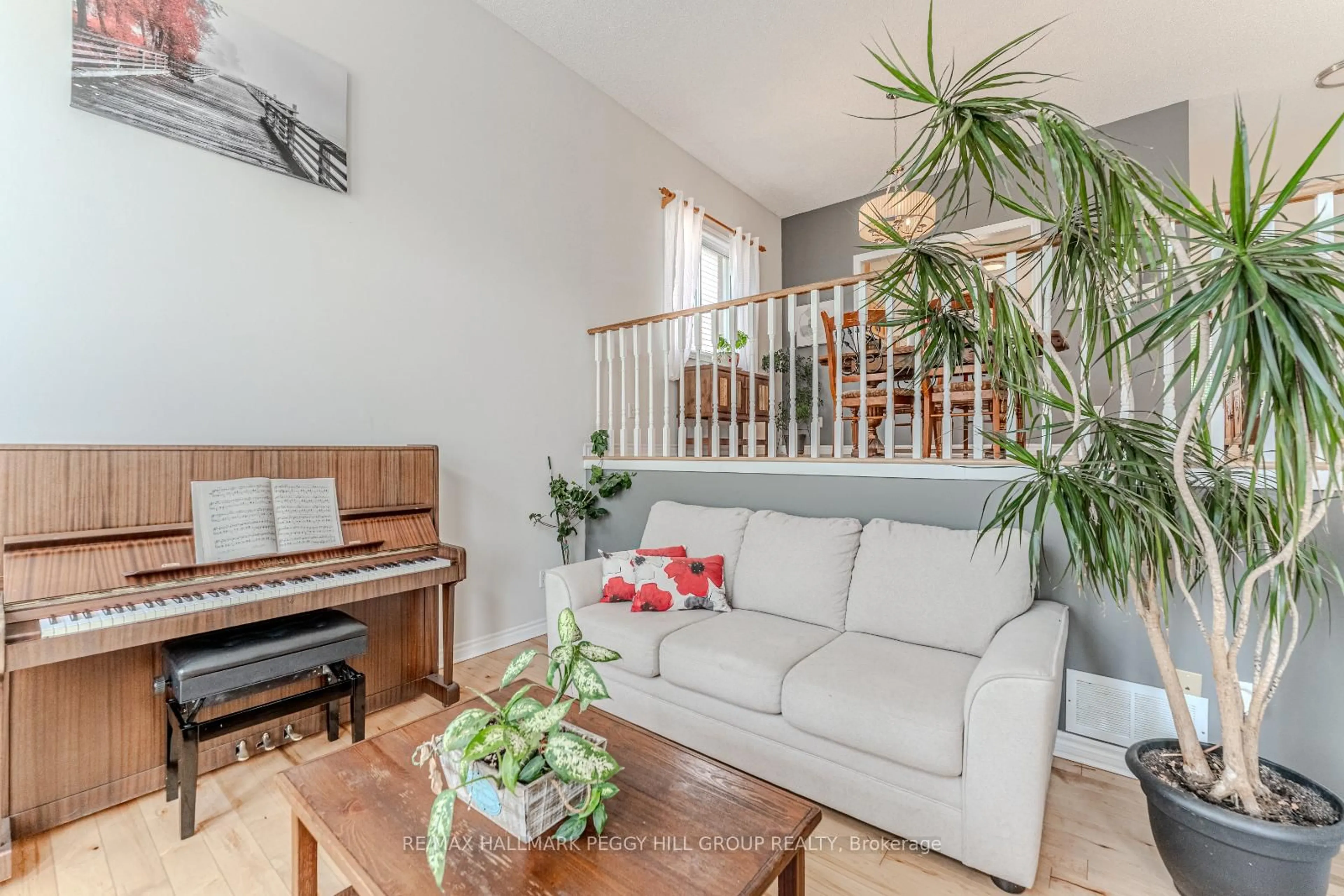 Living room with furniture, wood/laminate floor for 255 Mapleton Ave, Barrie Ontario L4N 8T3