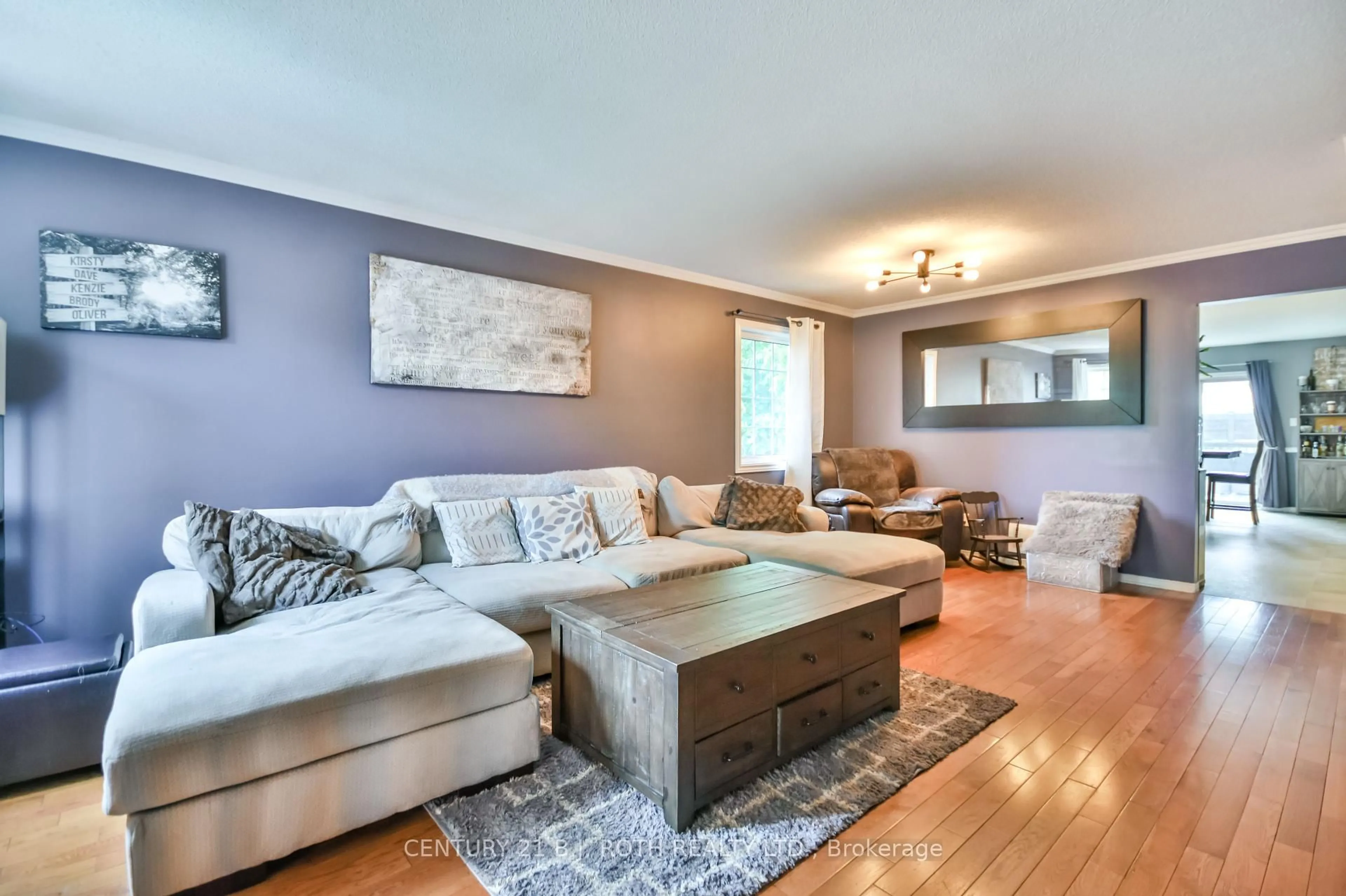 Living room with furniture, wood/laminate floor for 56 Monique Cres, Barrie Ontario L4M 6Y4