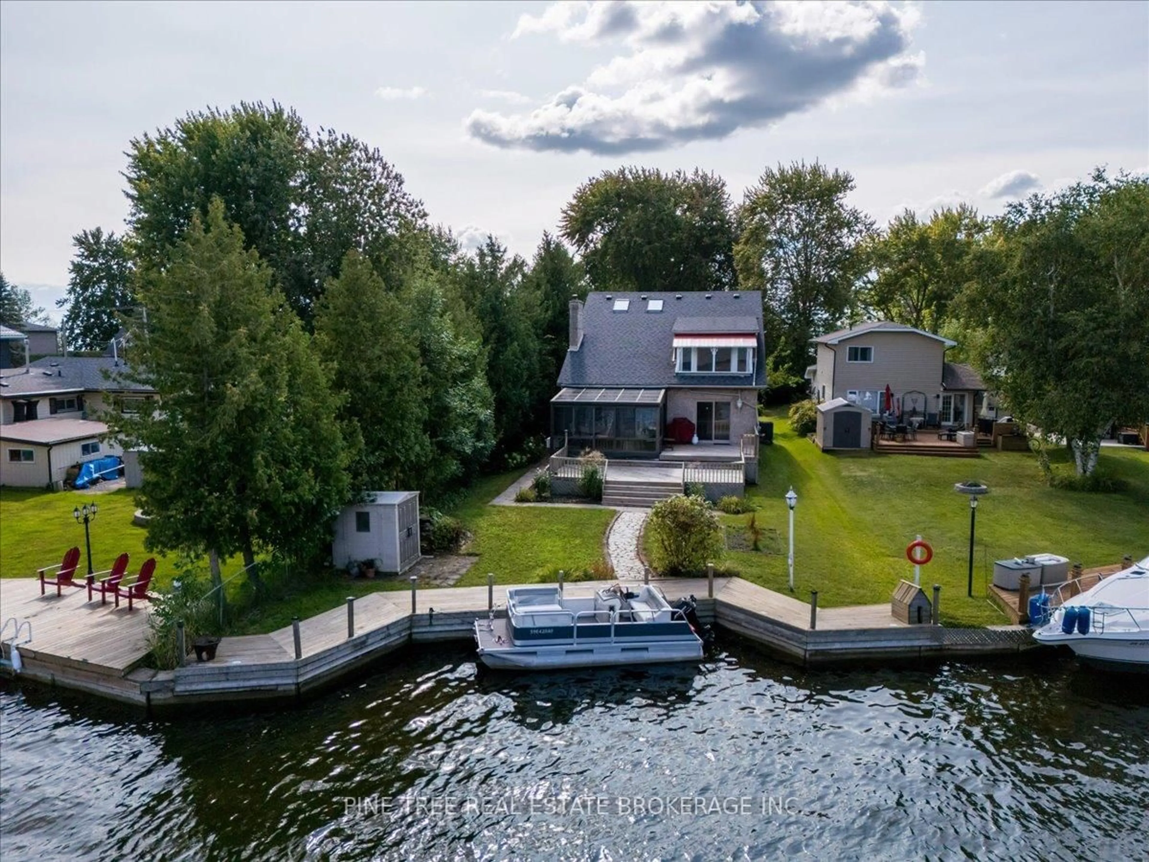 A pic from outside/outdoor area/front of a property/back of a property/a pic from drone, water/lake/river/ocean view for 57 Lake Ave, Ramara Ontario L0K 1B0