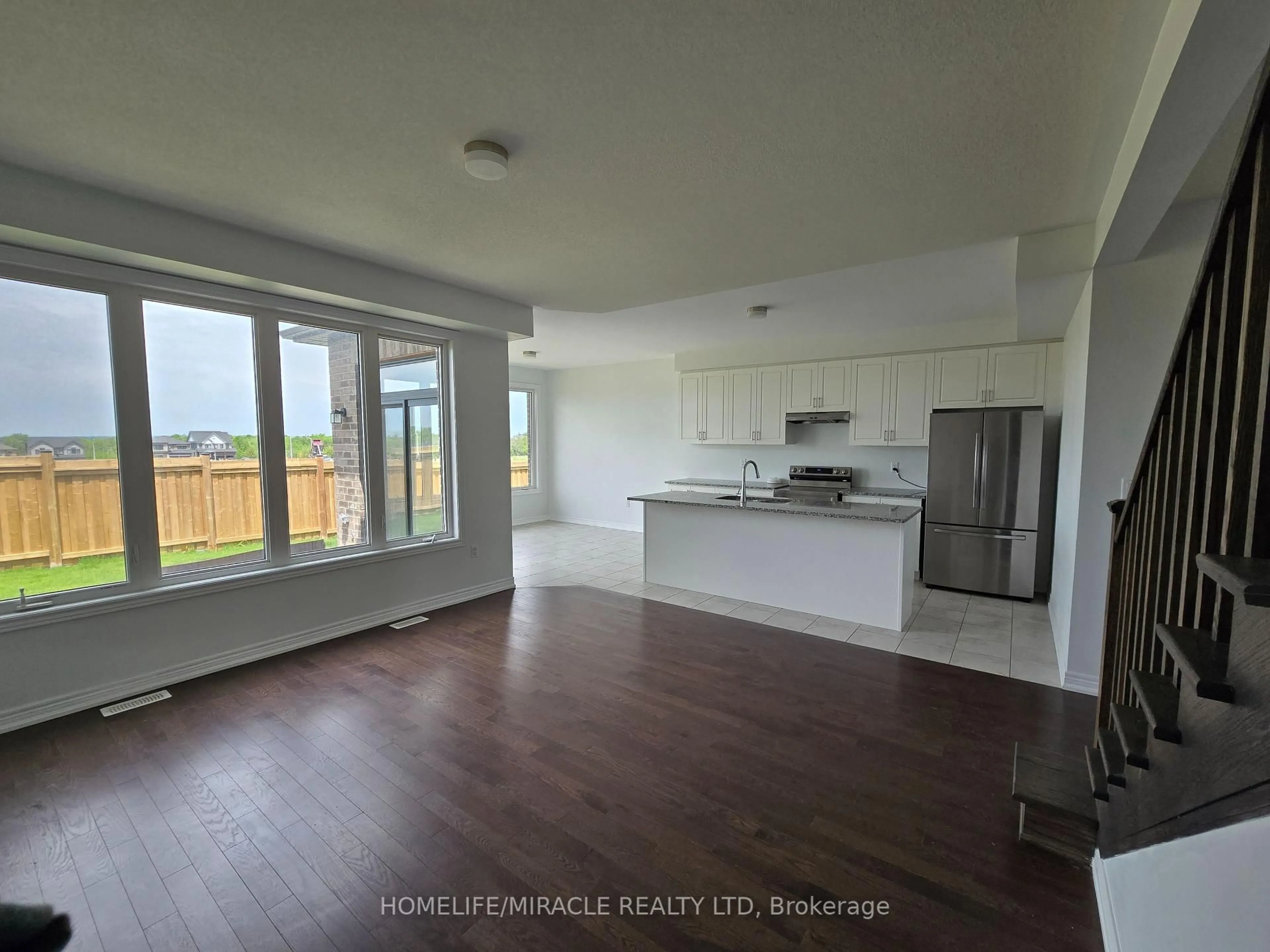 Open concept kitchen, wood/laminate floor for 175 Fenchurch Manr, Barrie Ontario L9J 0B7