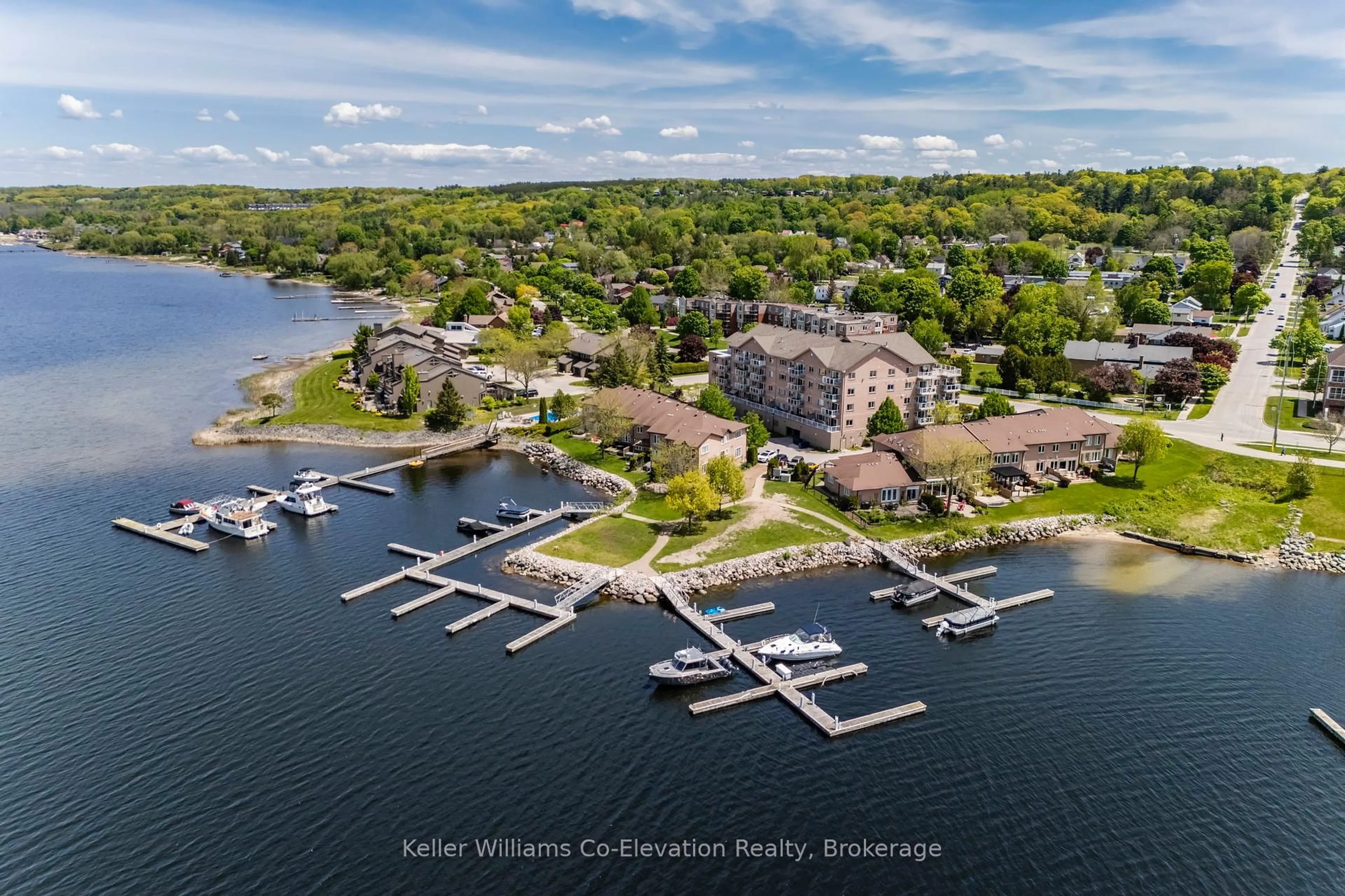 A pic from outside/outdoor area/front of a property/back of a property/a pic from drone, water/lake/river/ocean view for 4 Beck Blvd #302, Penetanguishene Ontario L9M 2H3