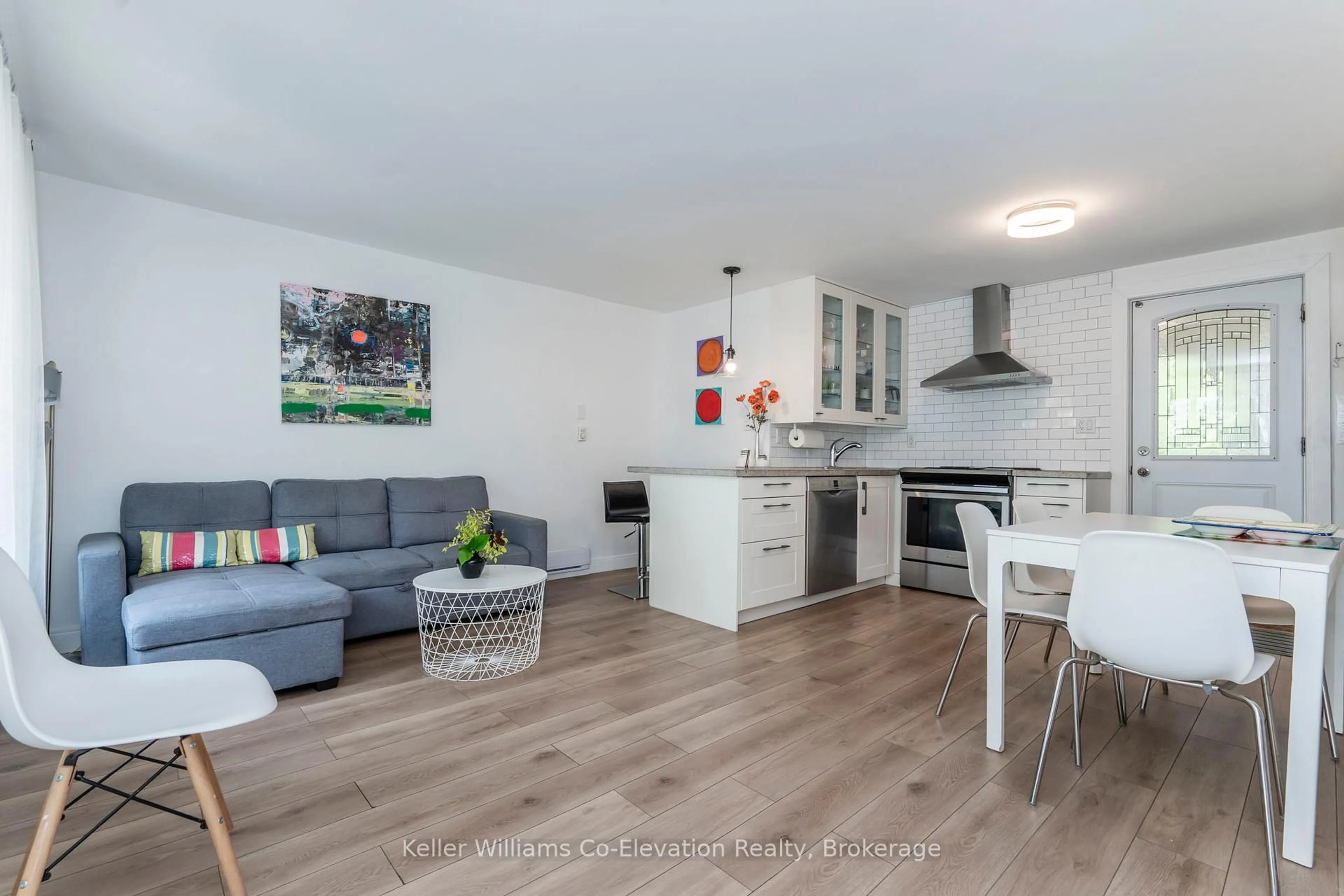 Open concept kitchen, wood/laminate floor for 730 Concession 15 Rd, Tiny Ontario L9M 1R3