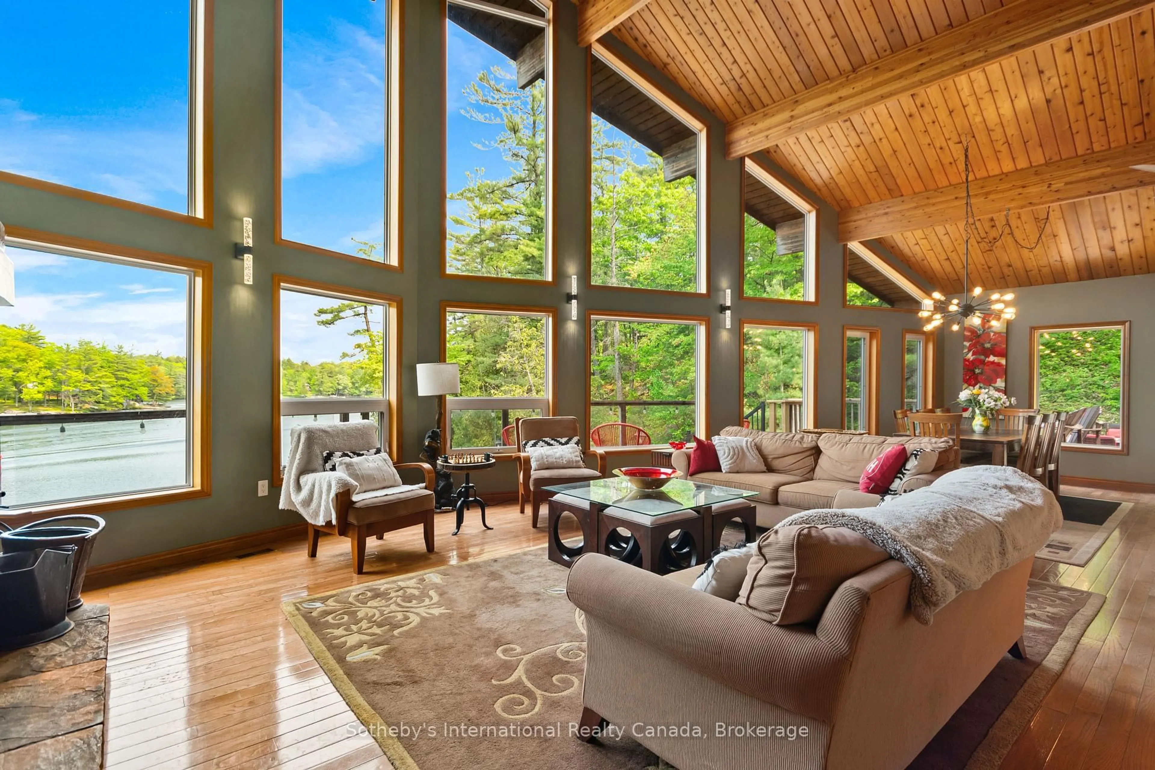 Living room with furniture, wood/laminate floor for 2039 Beaver Dam Rd, Severn Ontario P0C 1M0