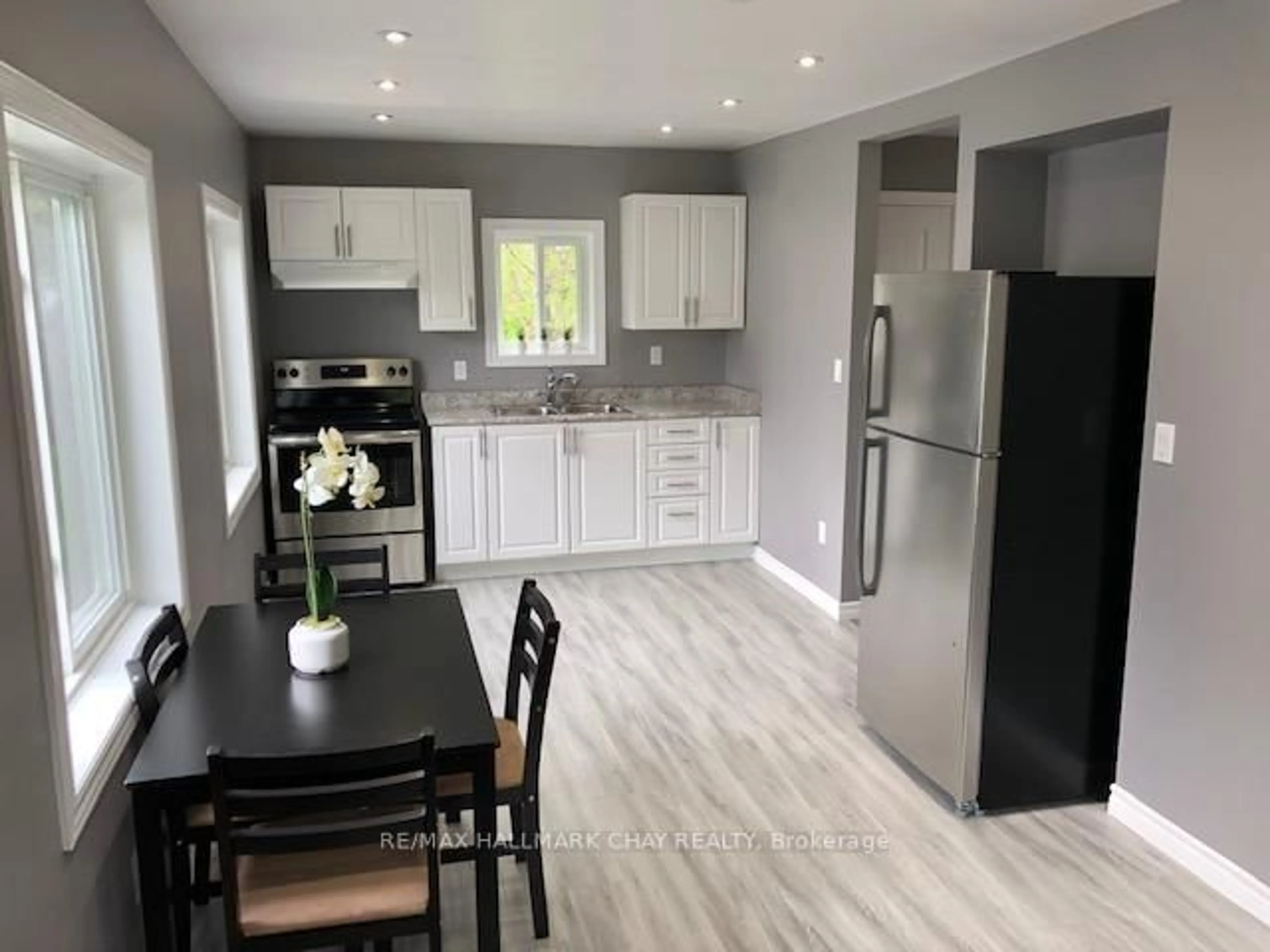 Open concept kitchen, wood/laminate floor for 12 Dufferin St #1, 2, C, Barrie Ontario L4N 2J7