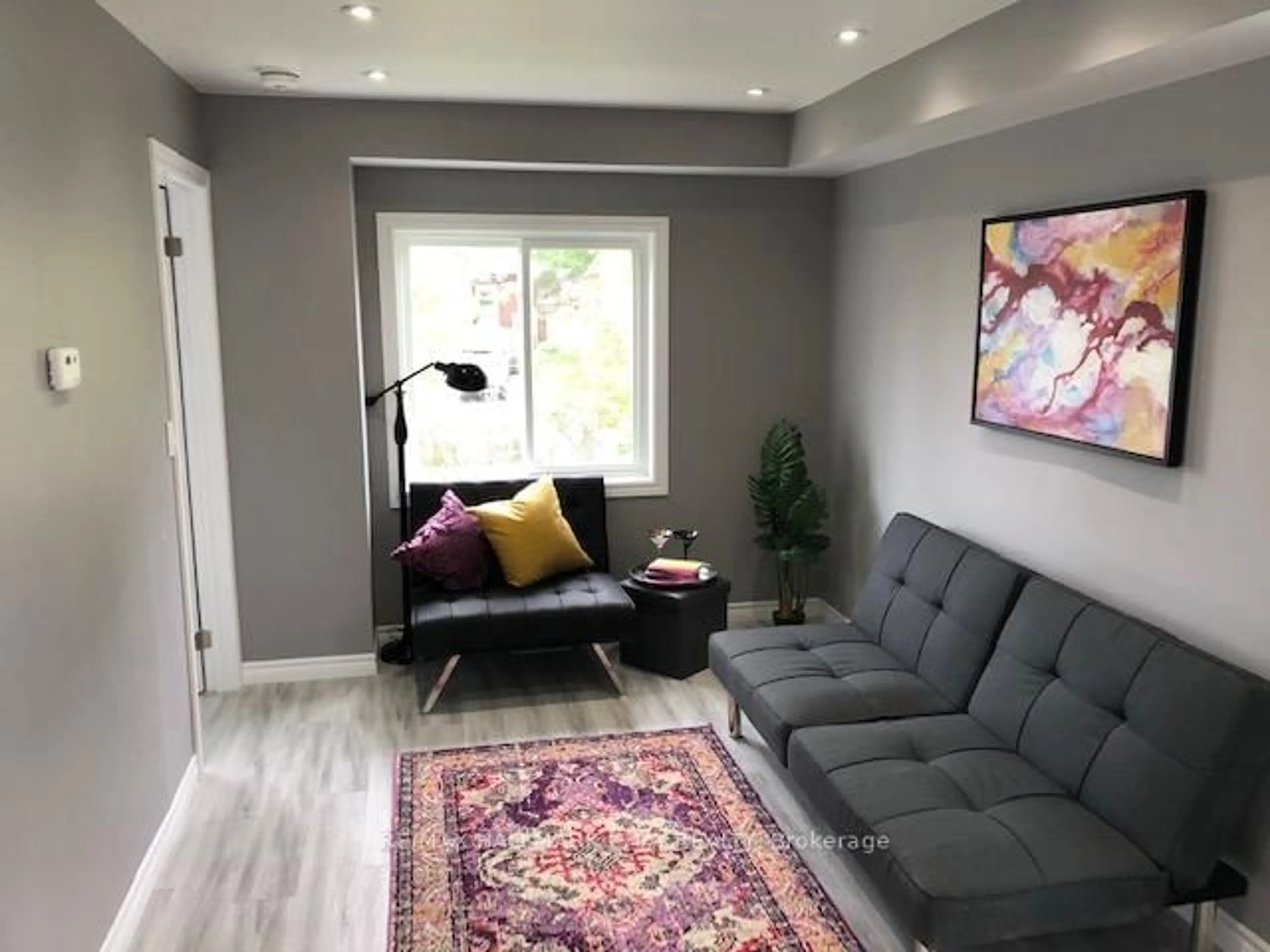 Living room with furniture, unknown for 12 Dufferin St #1, 2, C, Barrie Ontario L4N 2J7