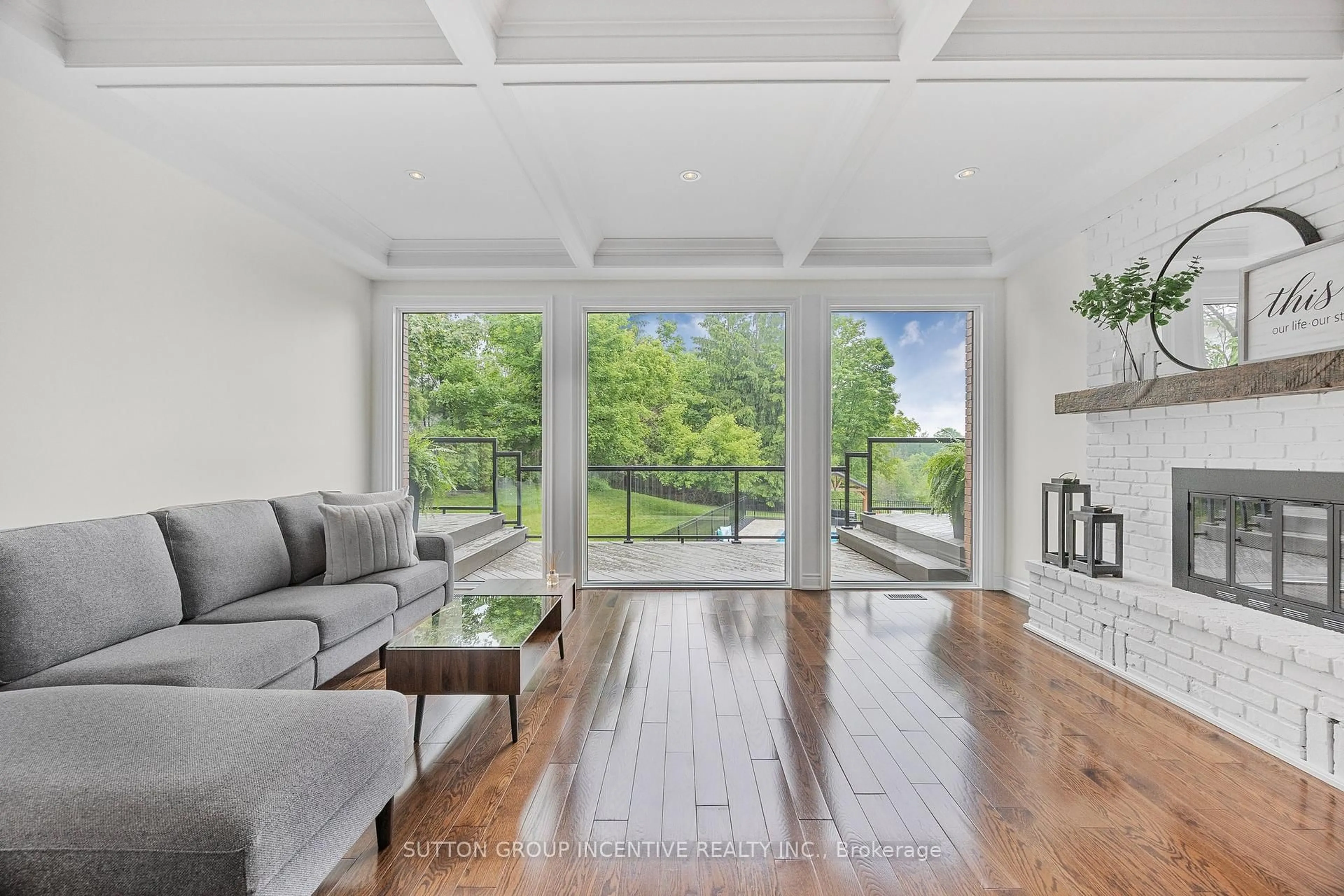 Living room with furniture, wood/laminate floor for 214 Hickory Lane, Barrie Ontario L4N 4J8