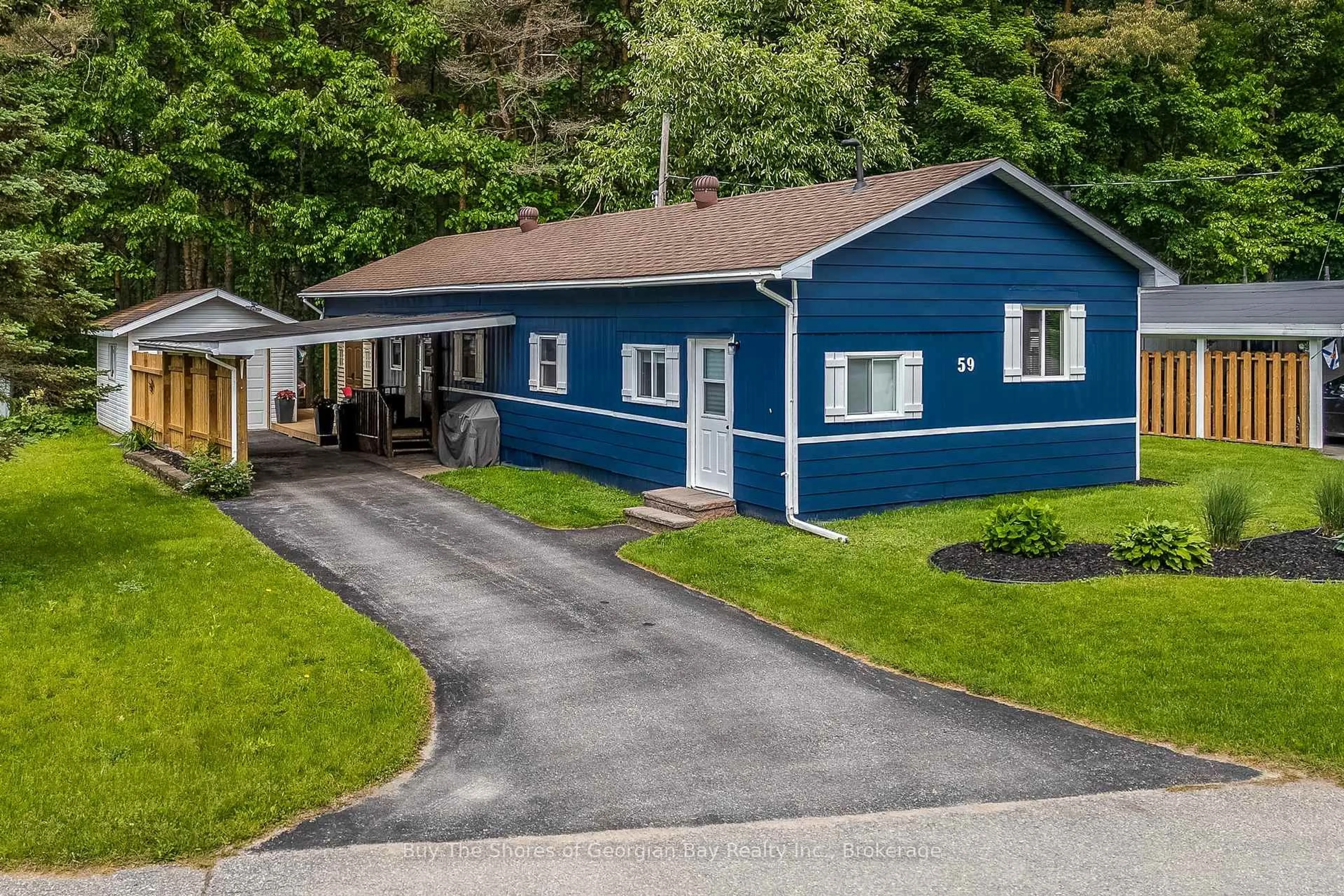 A pic from outside/outdoor area/front of a property/back of a property/a pic from drone, street for 525 Midland Point Rd #59, Midland Ontario L4R 5G9