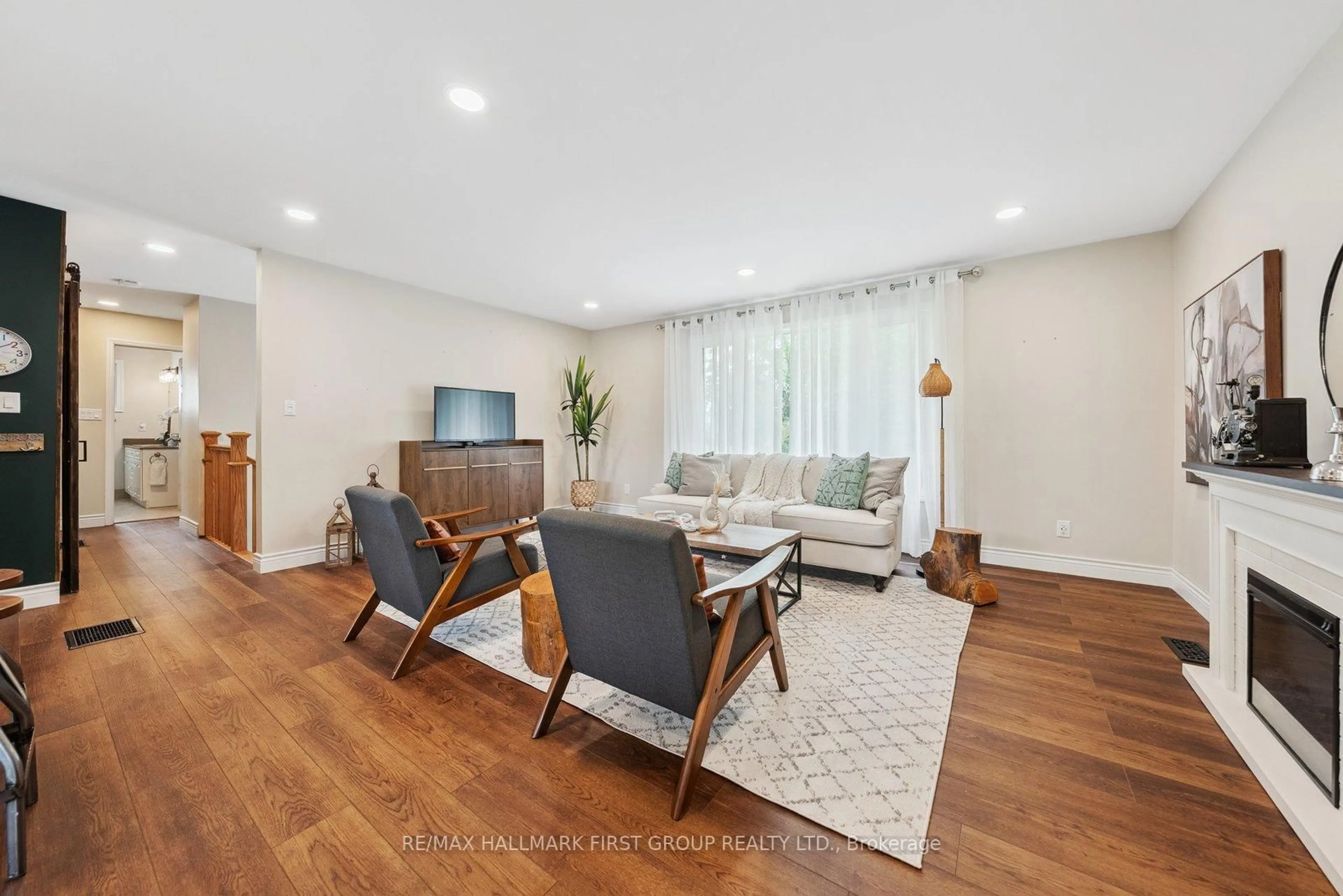 Living room with furniture, wood/laminate floor for 2738 Stephen Dr, Ramara Ontario L0K 1B0