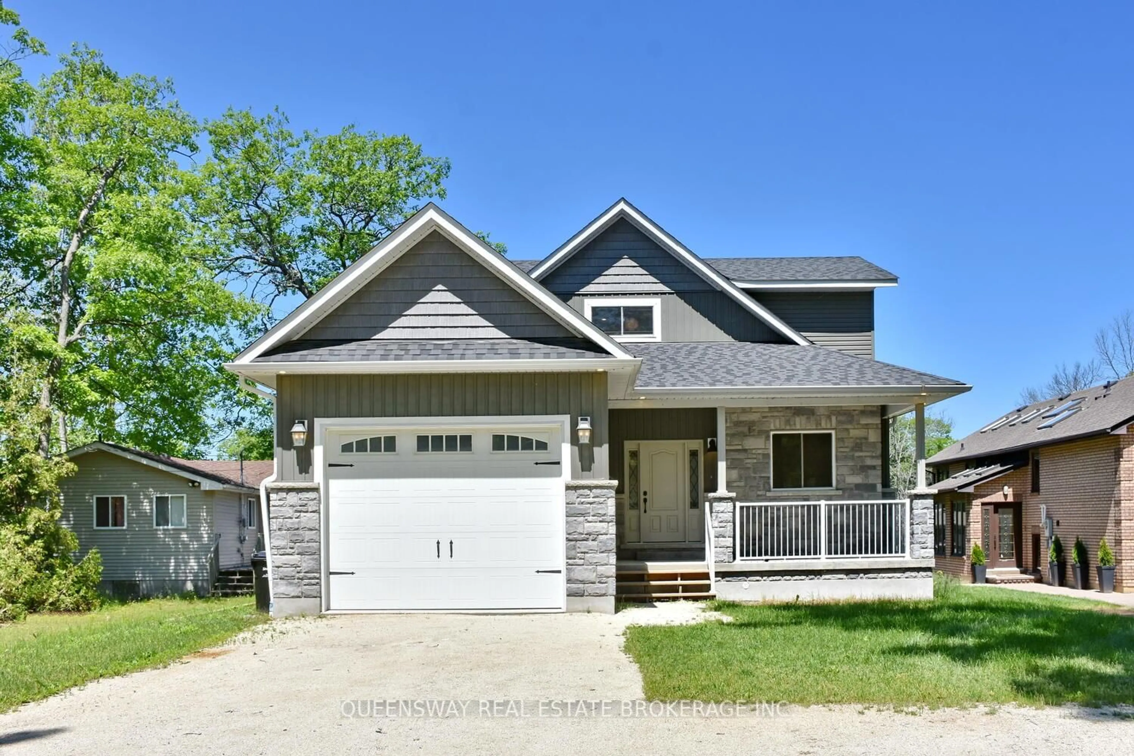 Home with vinyl exterior material, street for 1852 River Rd, Wasaga Beach Ontario L9Z 1K9