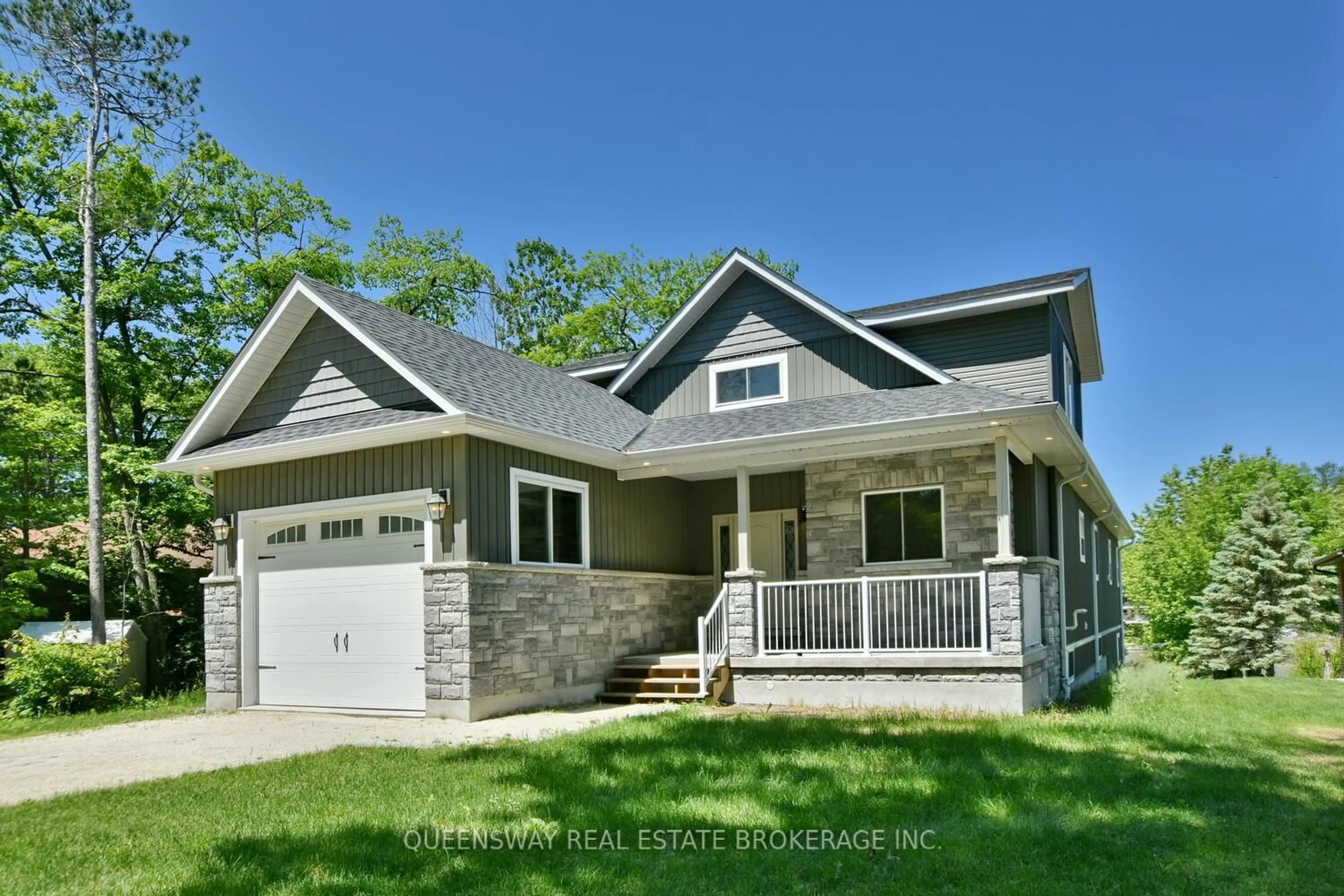 Home with vinyl exterior material, street for 1852 River Rd, Wasaga Beach Ontario L9Z 1K9