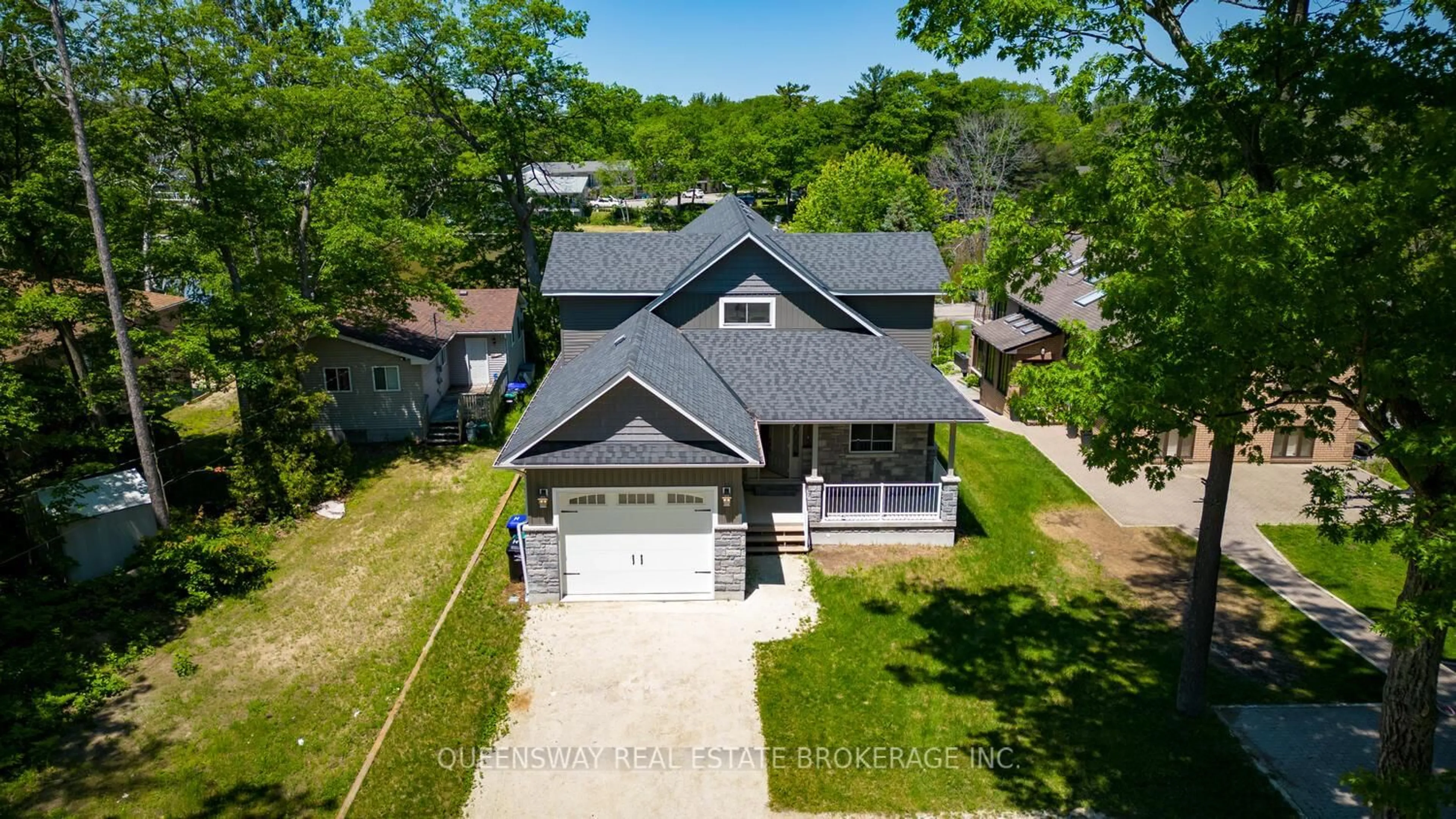 A pic from outside/outdoor area/front of a property/back of a property/a pic from drone, street for 1852 River Rd, Wasaga Beach Ontario L9Z 1K9